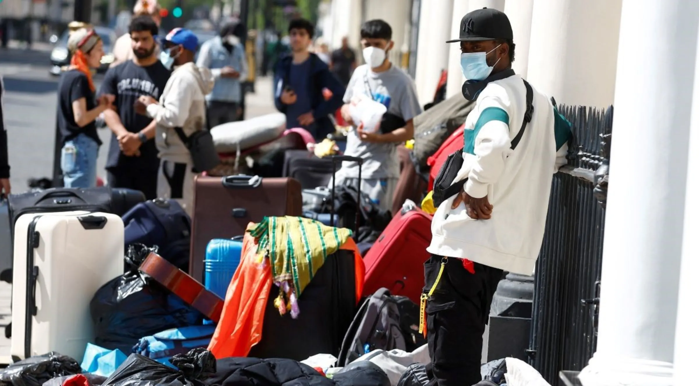 People believed to be asylum seekers stage a protest over the condition of their accommodation, outside of a hotel in London, Britain, June 2 2023