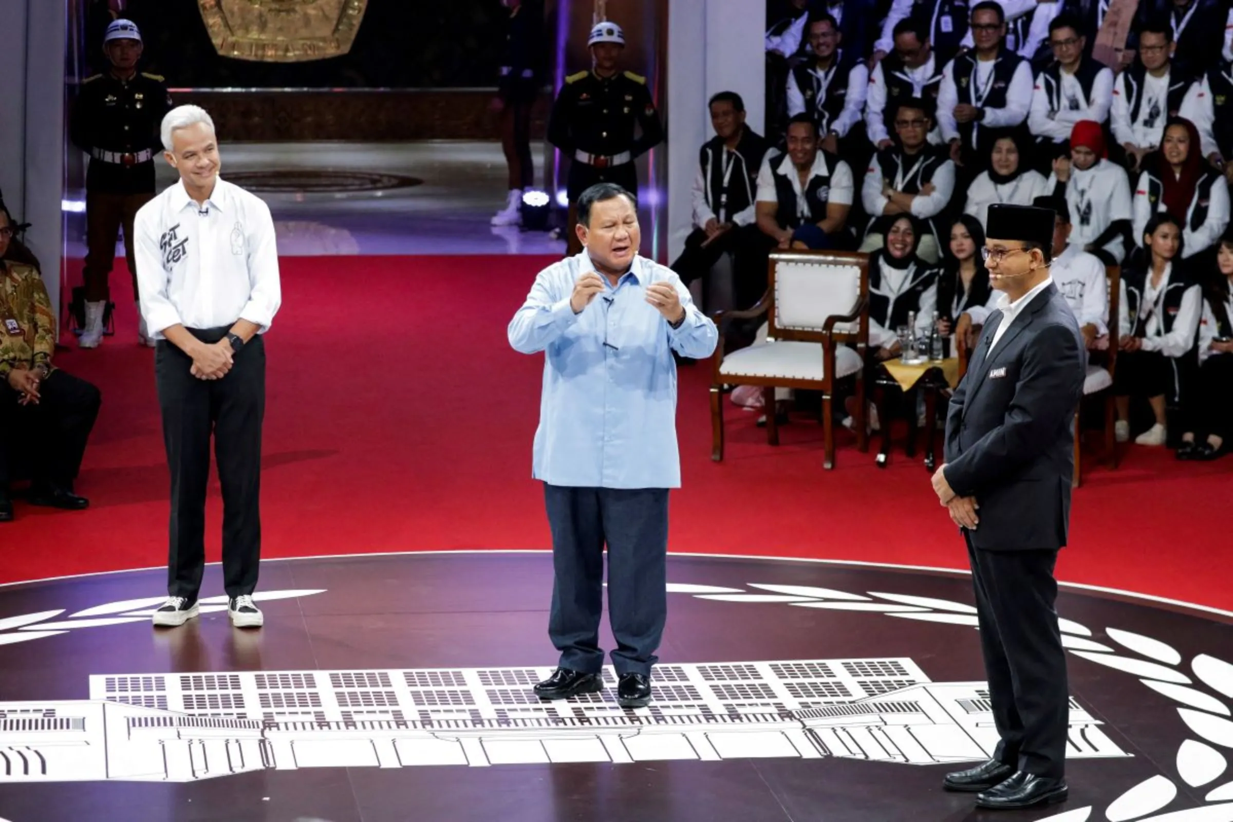 Ganjar Pranowo, presidential candidate of the ruling Indonesian Democratic Party of Struggle (PDI-P), Indonesia's Defence Minister and presidential candidate, Prabowo Subianto, and presidential candidate Anies Baswedan attend a televised debate at the election commission headquarters in Jakarta, Indonesia, December 12, 2023