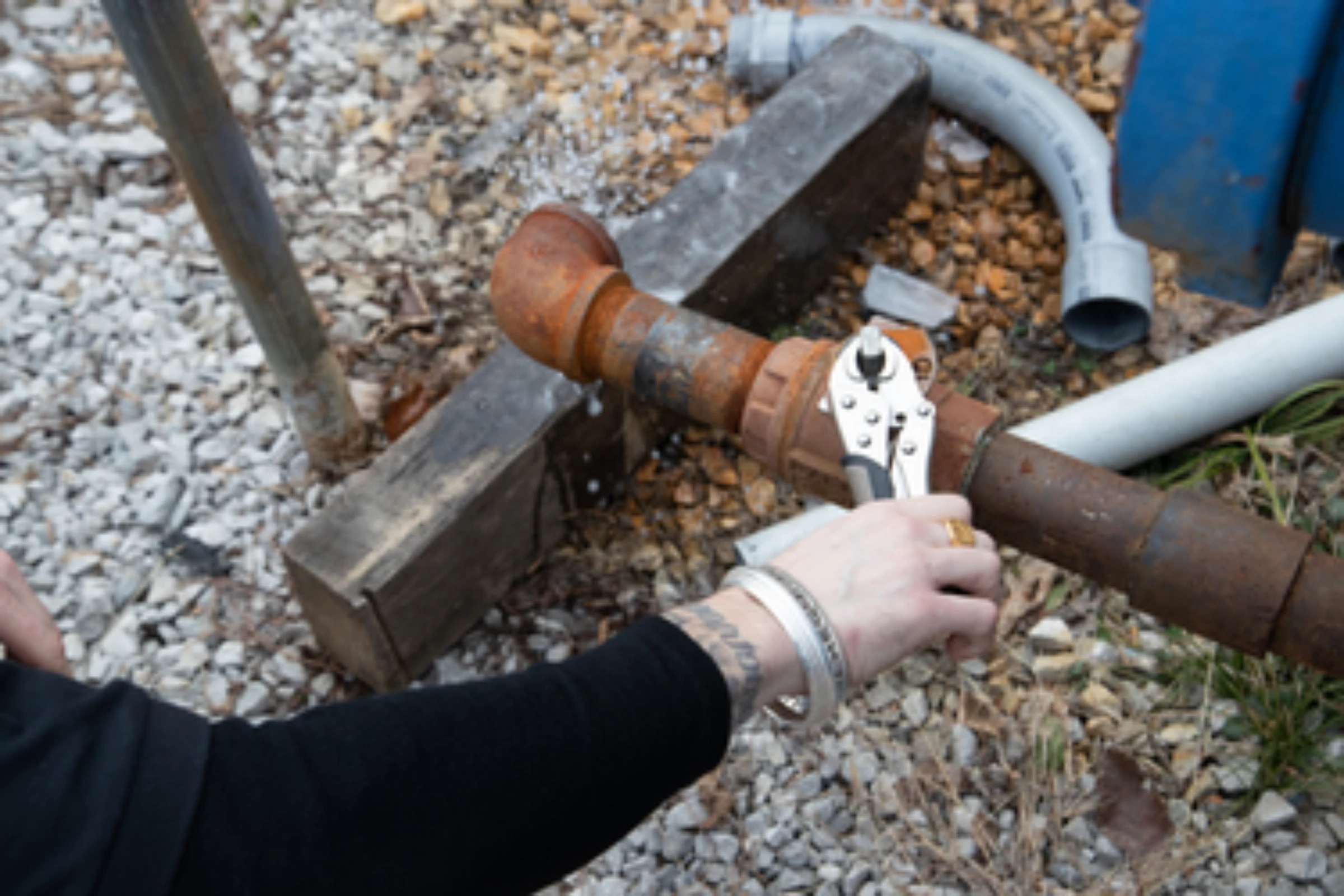 An “off-grid” bitcoin miner who goes by the name “Hodl Tarantula” opens a gas valve to release water in Manchester, Kentucky, January 27, 2022. Thomson Reuters Foundation/Amira Karaoud