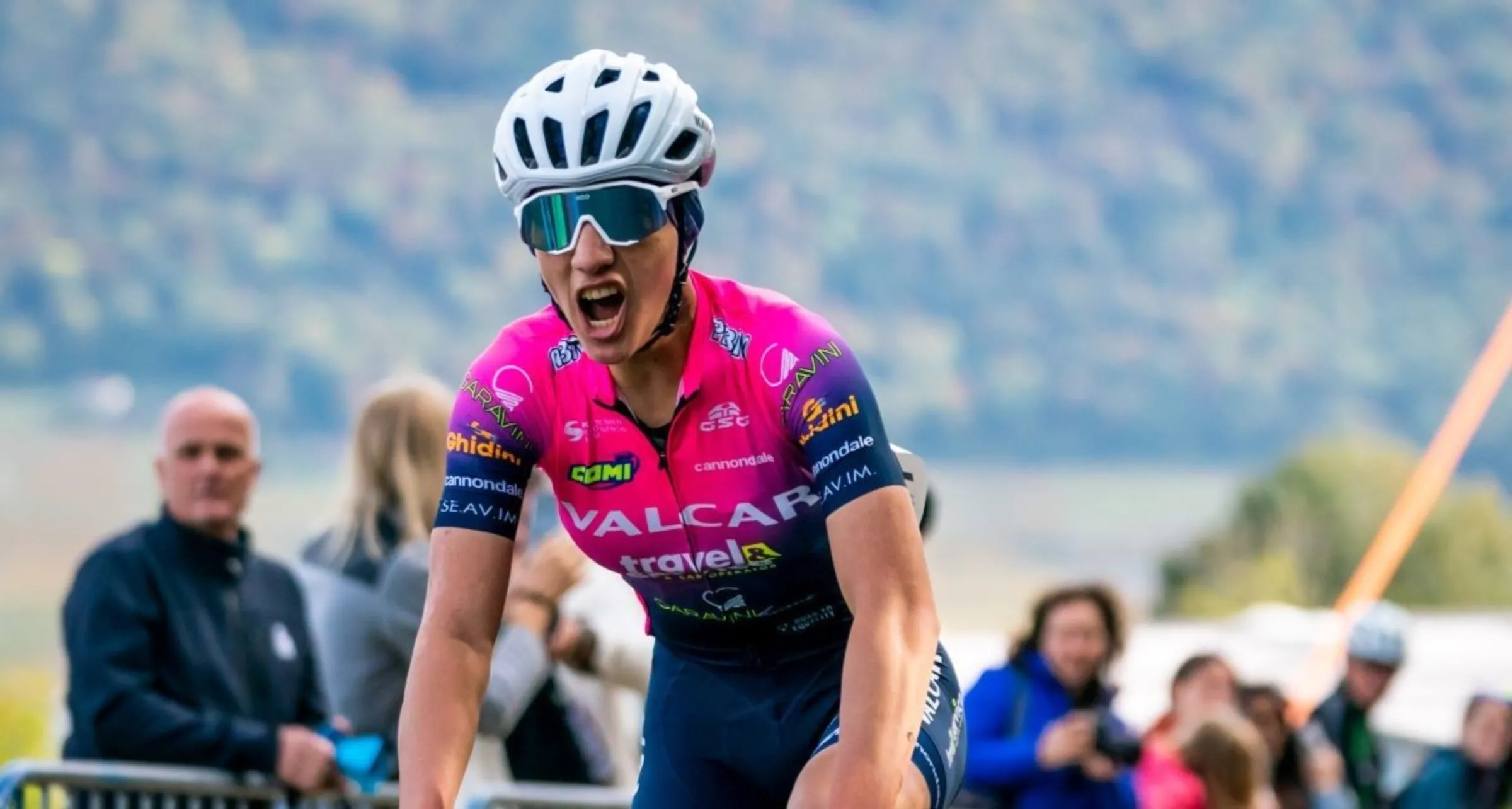 Fariba Hashmi celebrates after winning the Women's Road Championships of Afghanistan in Aigle, Switzerland in October 2022. Union Cycliste Internationale (UCI)/Handout via Thomson Reuters Foundation