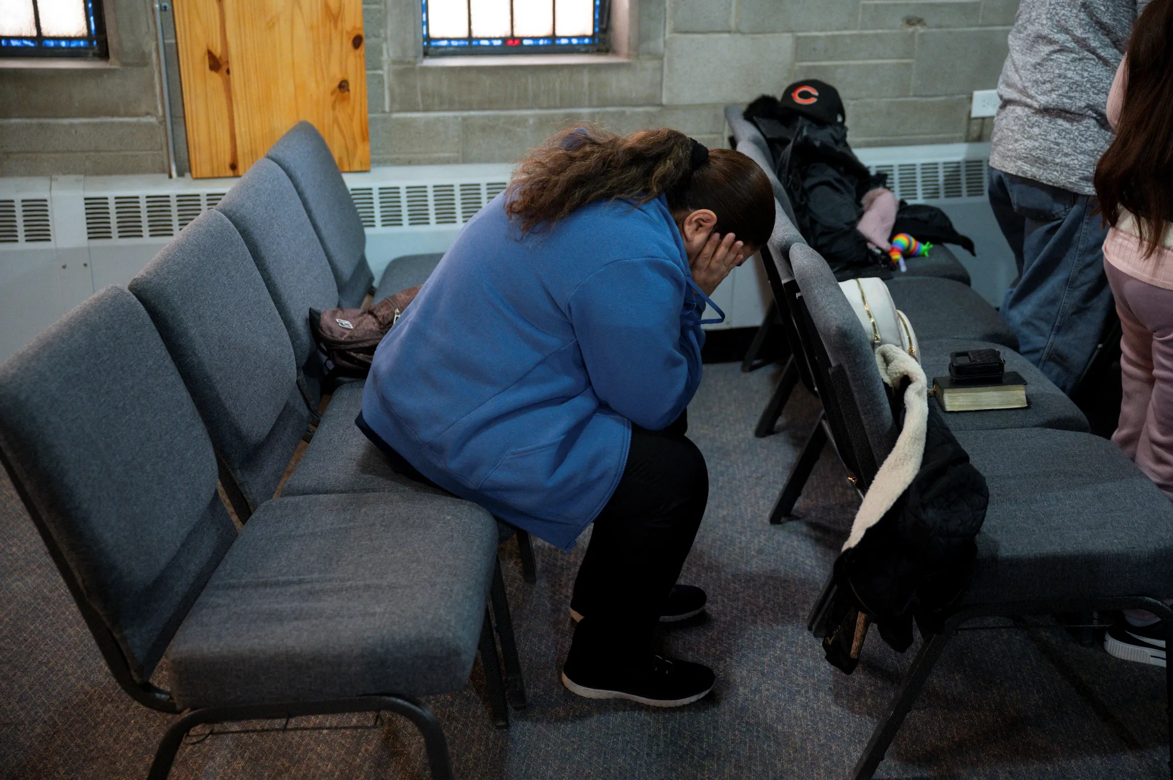 A woman attends a service at Starting Point Community Church, amid concerns of intensified immigration enforcement by U.S. Immigration and Customs Enforcement (ICE) in Chicago, Illinois U.S. January 26, 2025. REUTERS/Vincent Alban