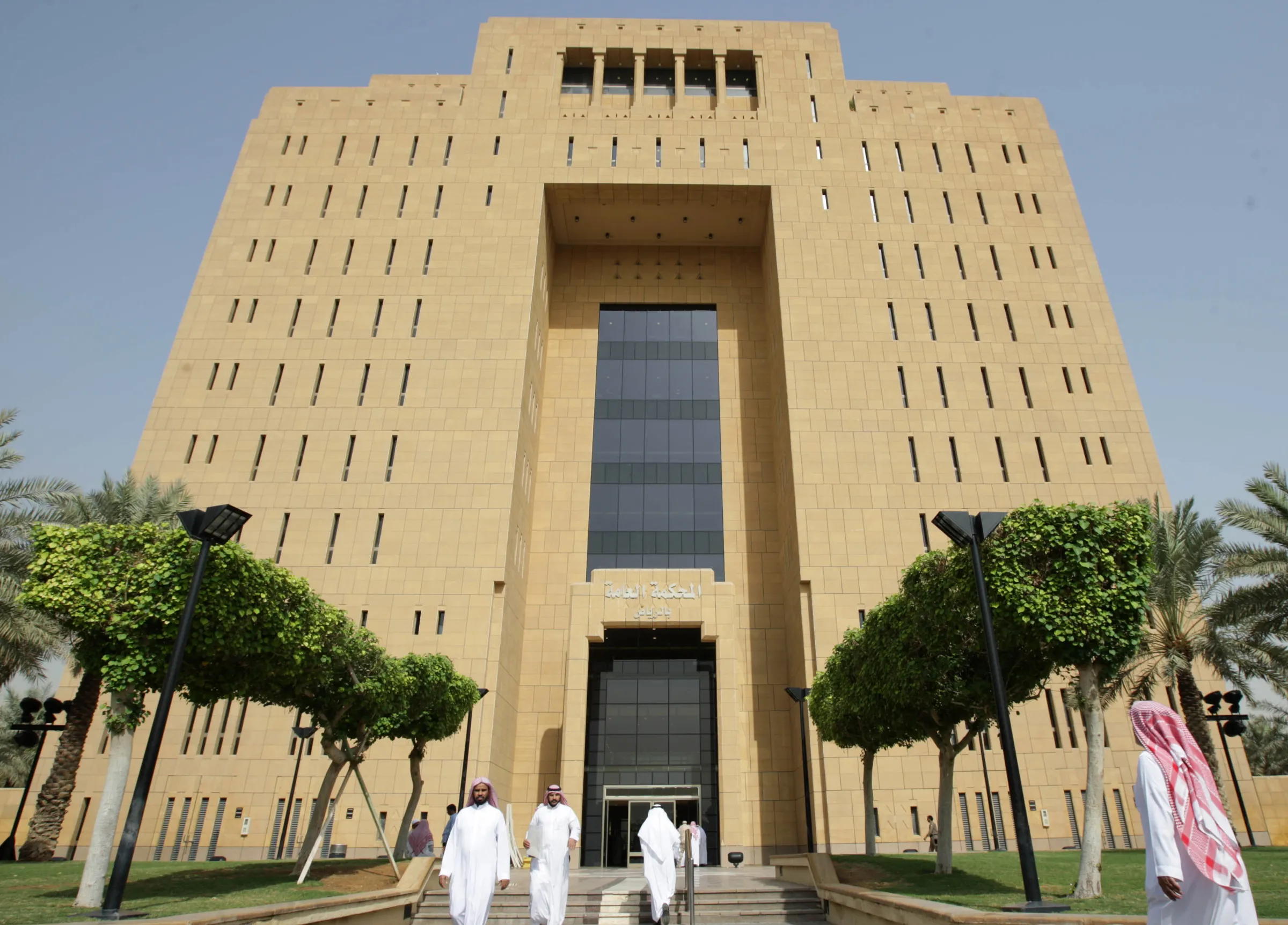 People enter and leave Riyadh's general court