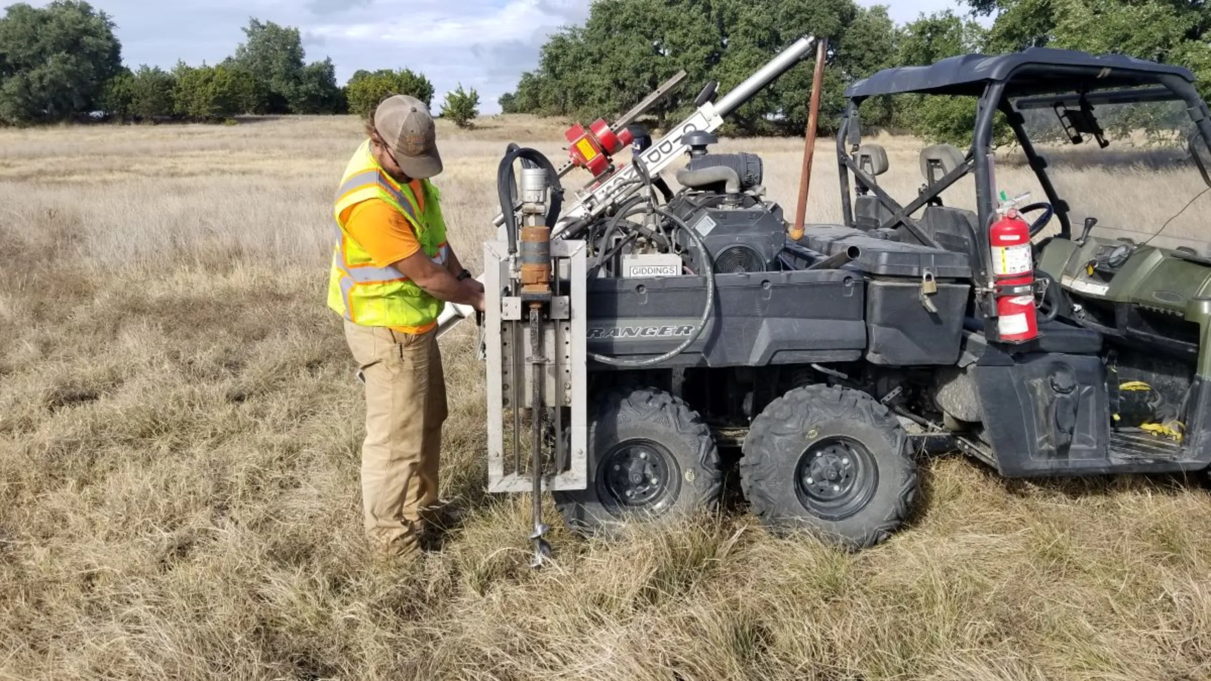 A worker does soil sampling to test for carbon at the Diamond K Ranch in Texas. November 20, 2019