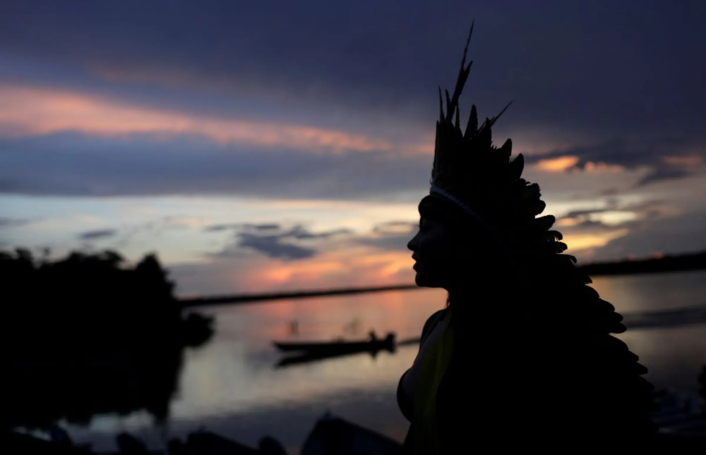 Indigenous leader of the Celia Xakriaba tribe walks next to the Xingu River during a four-day pow wow in Piaracu village, in Xingu Indigenous Park, near Sao Jose do Xingu, Mato Grosso state, Brazil, January 15, 2020. REUTERS/Ricardo Moraes