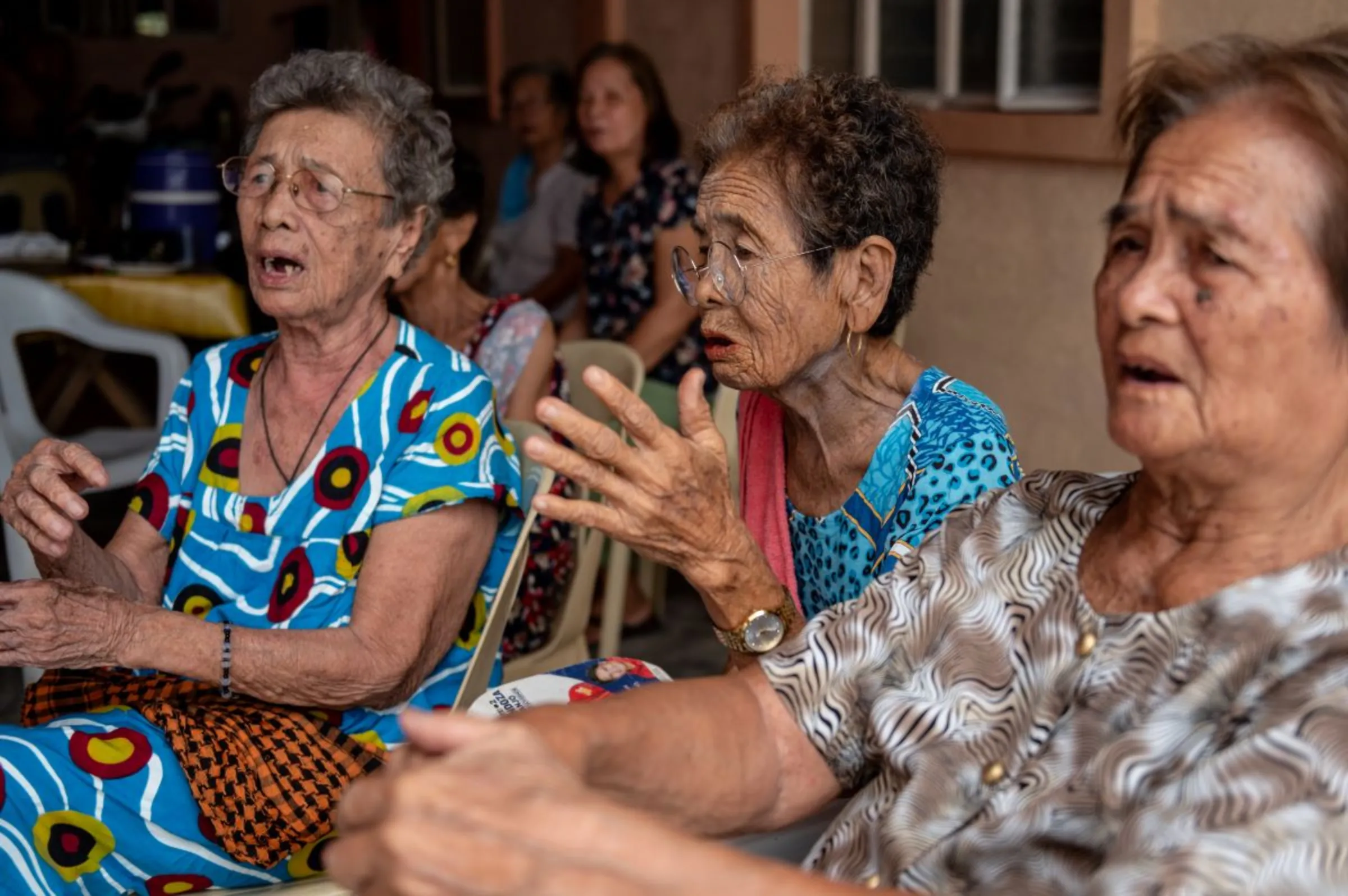 Members of the Malaya Lolas sing a song about their story, in Pampanga province, Philippines, August 24, 2023. Thomson Reuters Foundation/Lisa Marie David