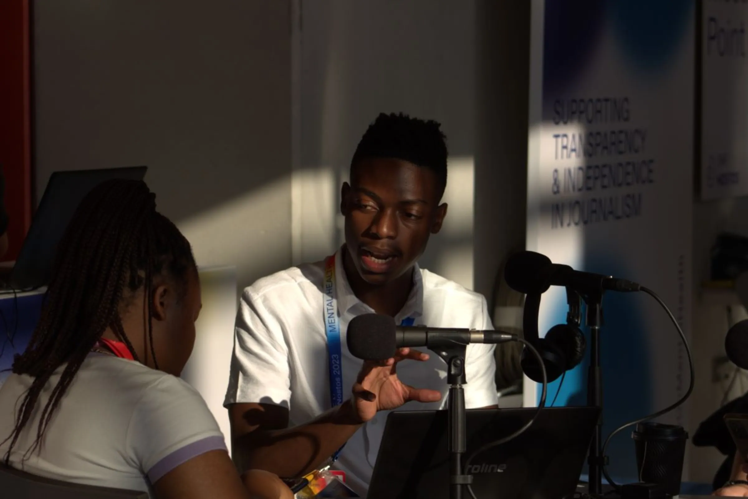 Radio personality and trainer Siya Mokoena engages with a colleague at a conference in Athens, Greece, June 2023. Radio Workshop/Handout via Thomson Reuters Foundation