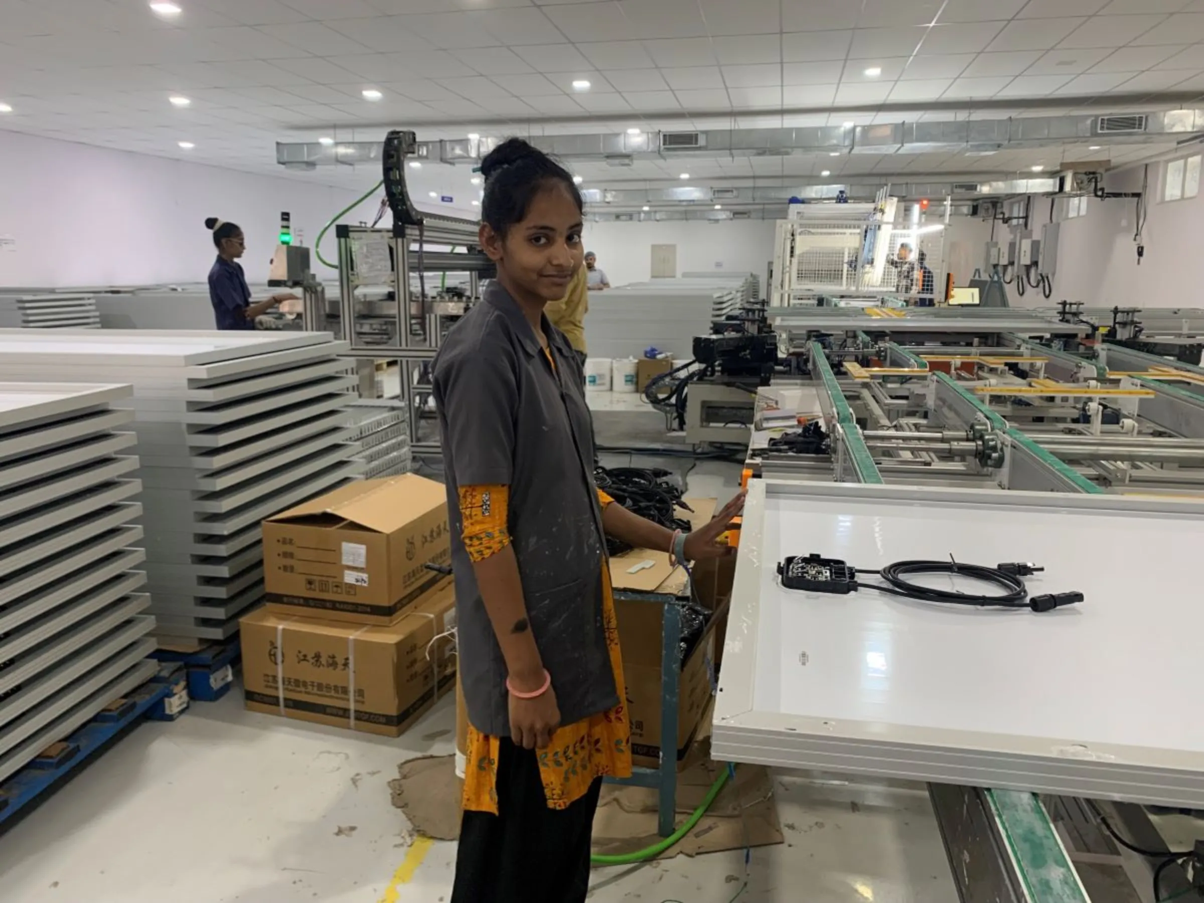 Kajal, 18, poses for a picture at solar manufacturing company Sunbond Energy Pvt Ltd in Mitana, India, May 29, 2023. Thomson Reuters Foundation/Anuradha Nagaraj
