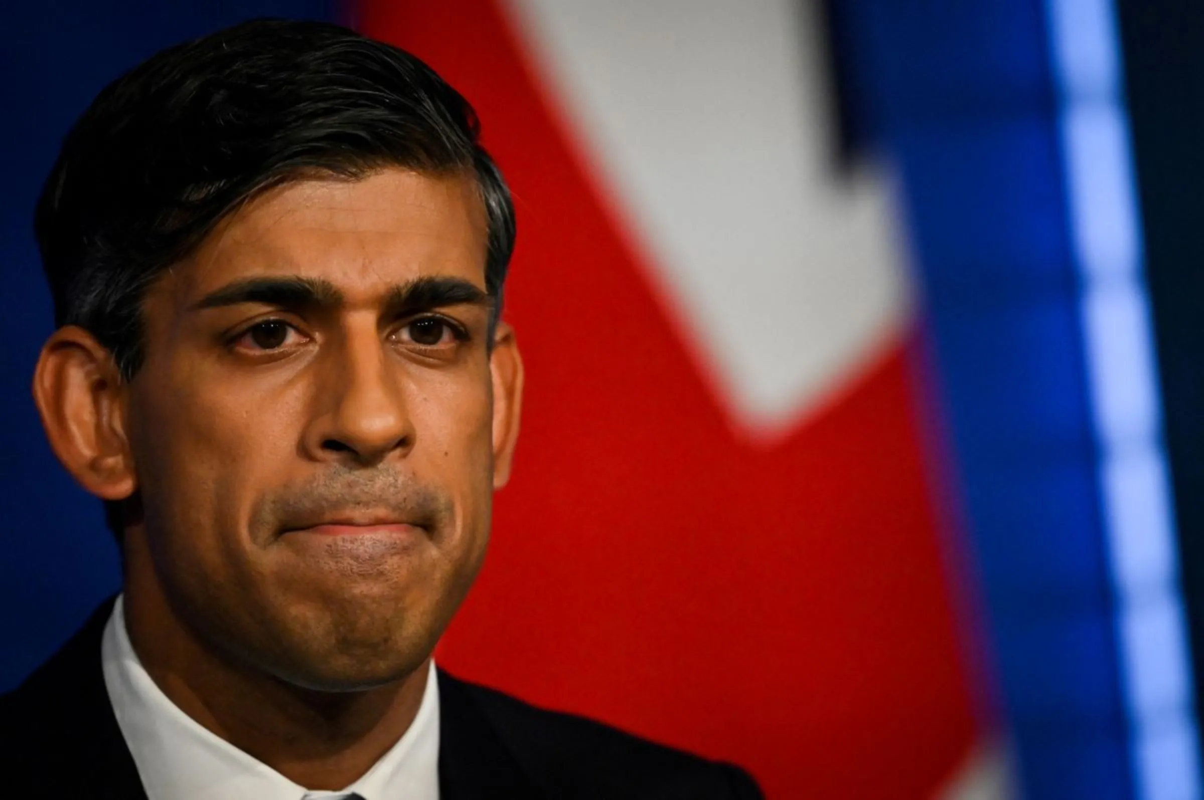 Britain's Prime Minister Rishi Sunak reacts as he delivers a speech during a press conference on the net zero target, at the Downing Street Briefing Room, in central London, on September 20, 2023. The UK looked set to backtrack on policies aimed at achieving net zero emissions by 2050 with Prime Minister Rishi Sunak expected to water down some of the government's green commitments. The move comes amid growing concern over the potential financial cost of the government's policies to achieve net zero carbon emissions by mid-century. JUSTIN TALLIS/Pool via REUTERS