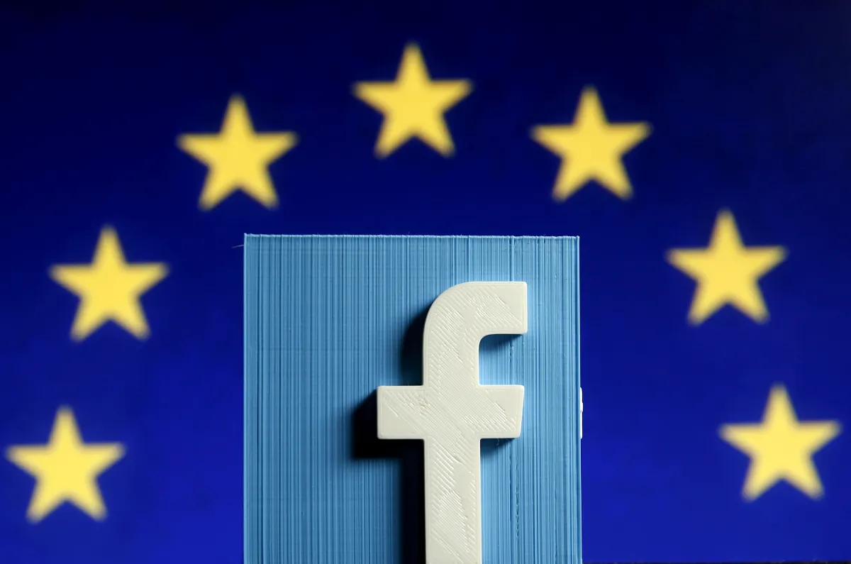 3D-printed Facebook logo is seen in front of the logo of the European Union