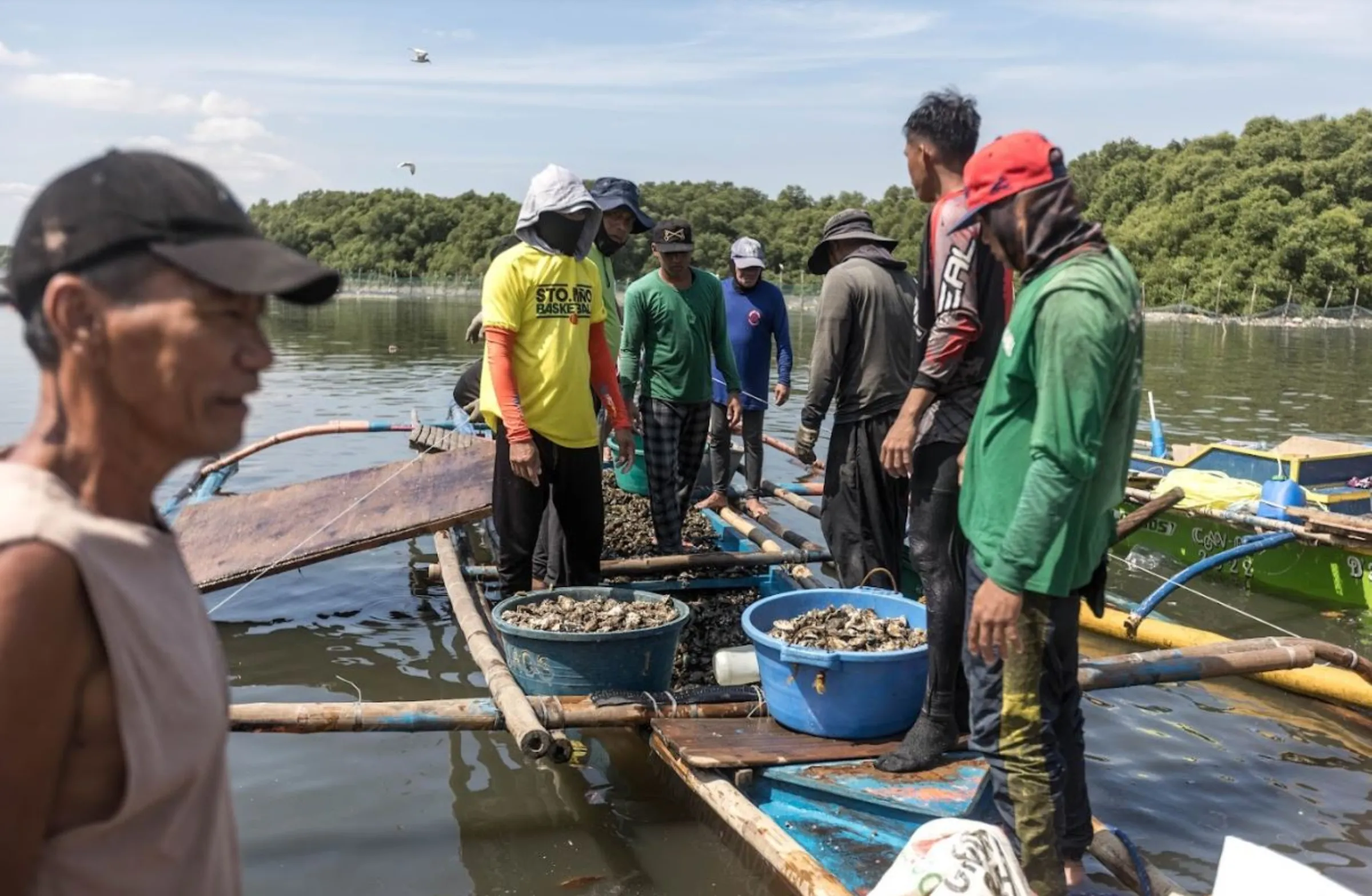 A busy crowd at the Bulungan market in Paranaque in Manila Bay, Philippines. February 22, 2023. Kathleen Lei Limayo/Thomson Reuters Foundation