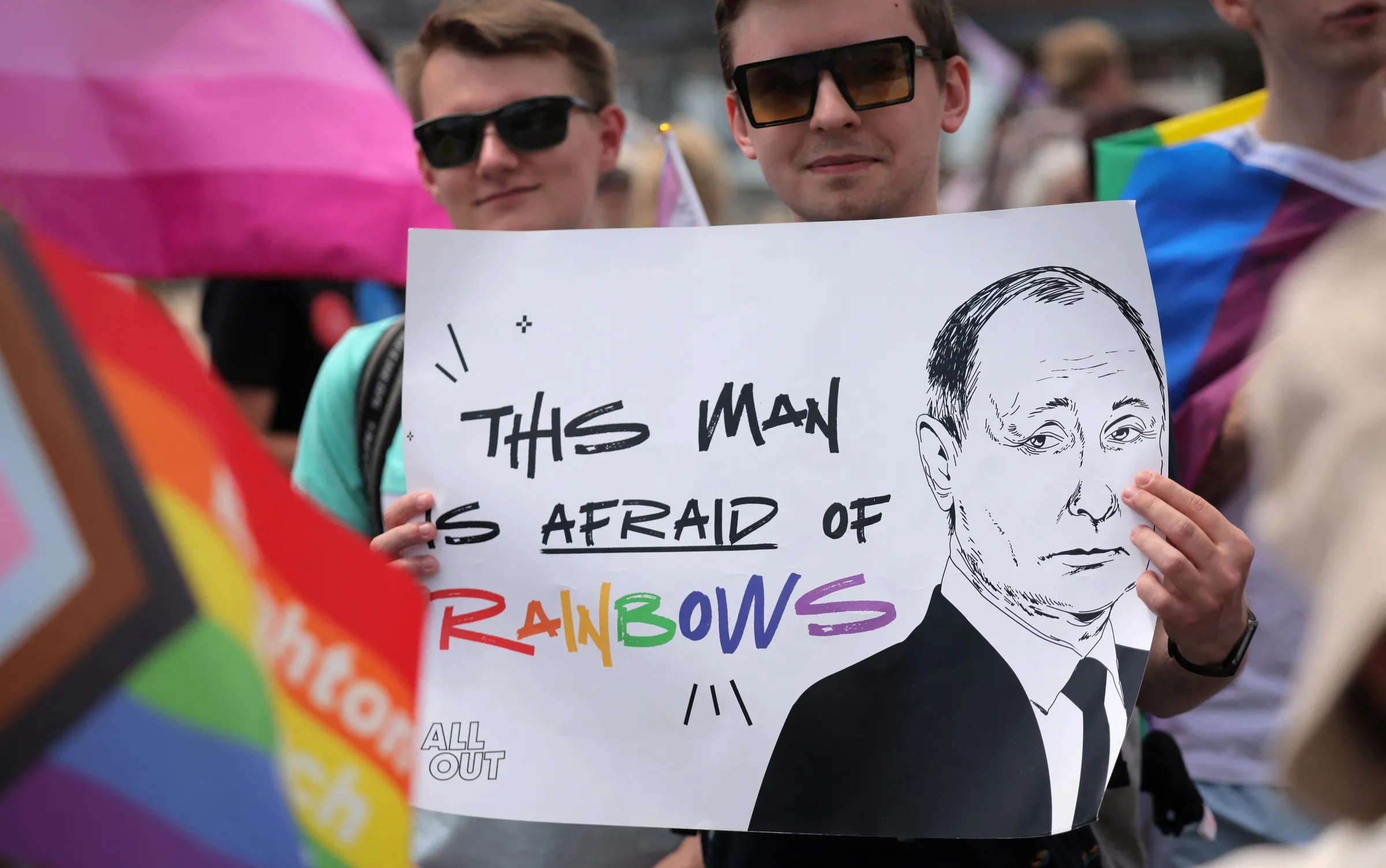 An attendee holds a placard with an image of Russian President Vladimir Putin at the Brighton Beach Pride march, in protest of Russia's designation of LGBTQ+ as an extremist organization, in Brooklyn, New York City, U.S., May 19, 2024. REUTERS/Andrew Kelly