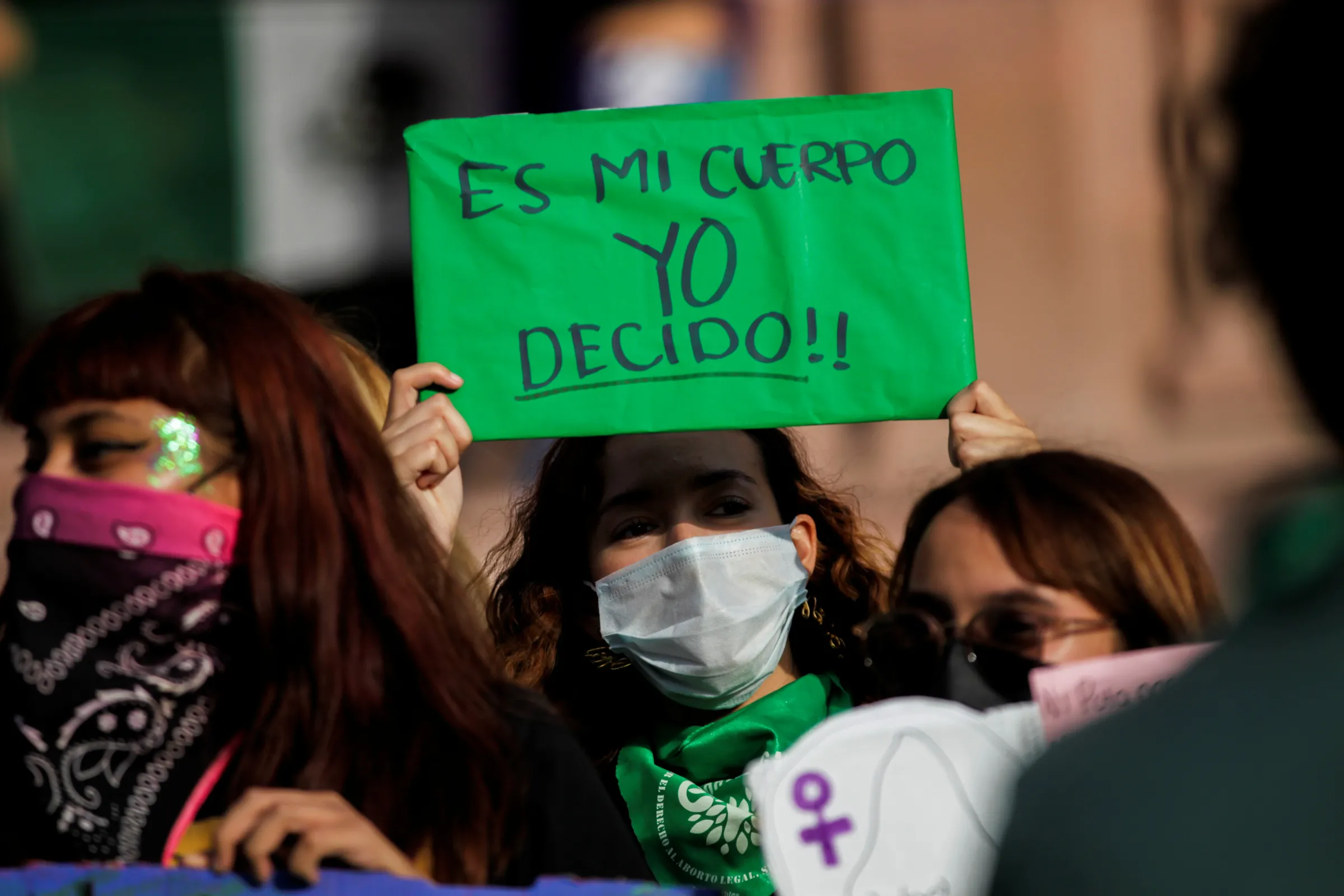 A woman wearing a face mask, holds up a banner which reads 'My body, I decide' during a protest to celebrate the decision of the Supreme Court of Justice of the Nation (SCJN) that declared the criminalization of abortion as unconstitutional