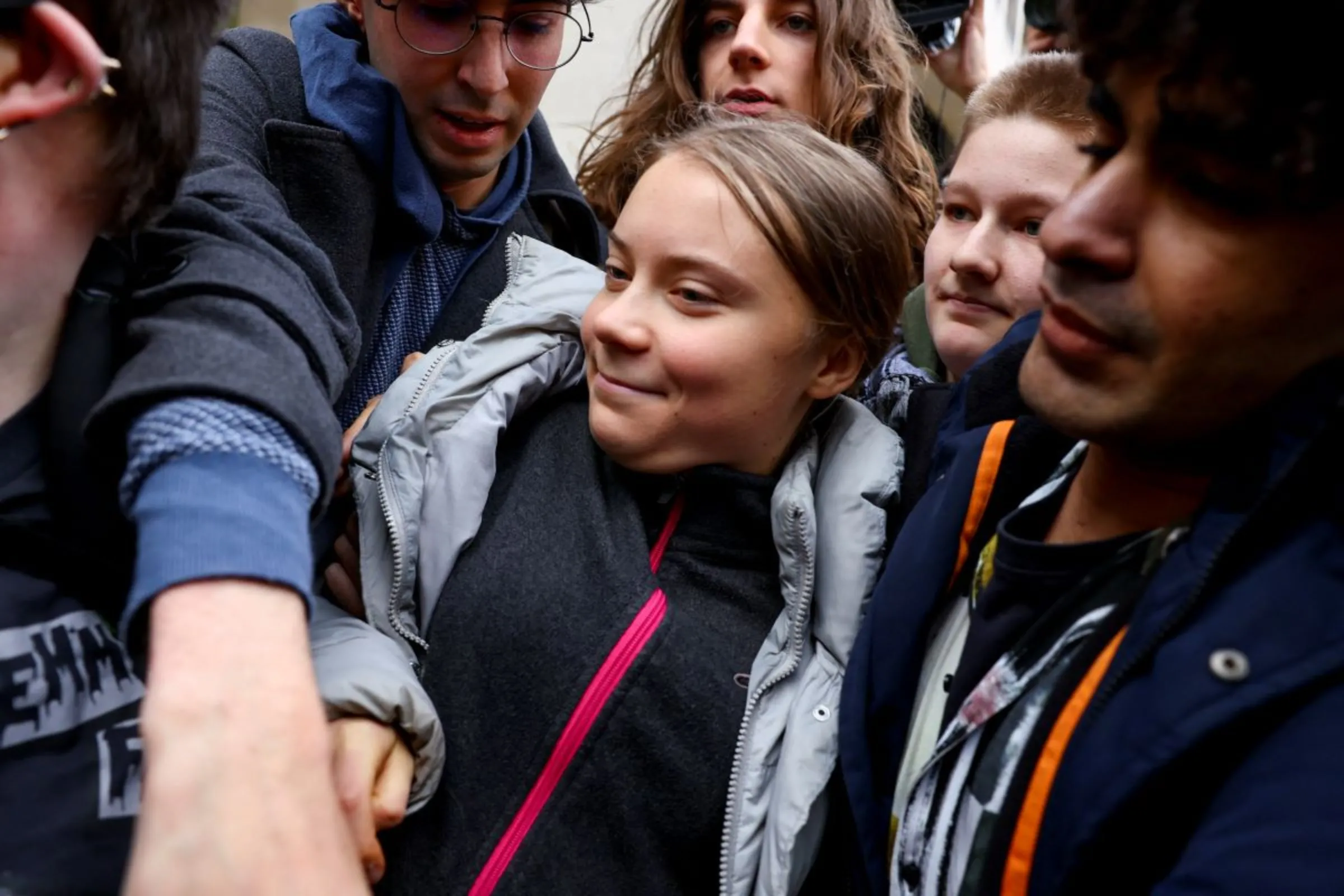 Climate activist Greta Thunberg reacts outside Westminster Magistrates' Court after she pleaded not guilty to a public order offence charge, in London, Britain, November 15, 2023
