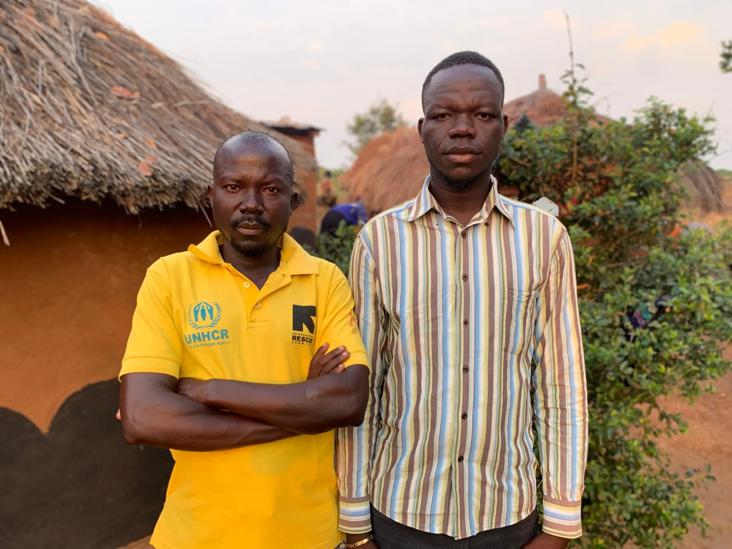 Yesua Aliki is pictured in Bidibidi with his friend Wilbert Dadi whose community liaison job with aid agency IRC has been suspended because of the aid freeze. February 2025. Yesua Aliki/Handout via Thomson Reuters Foundation