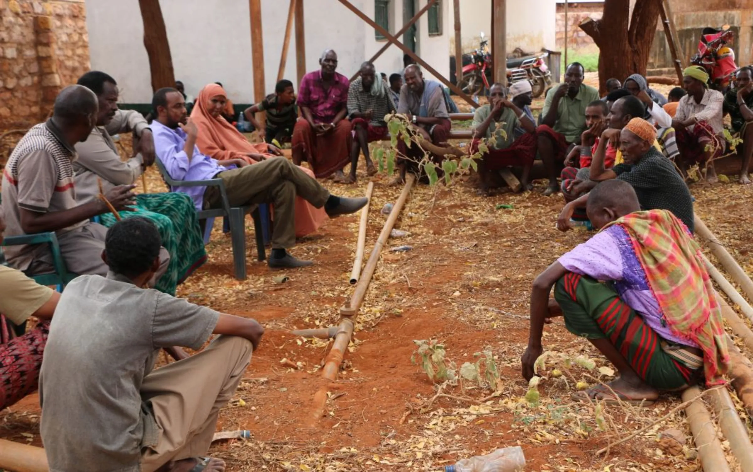 County government officials consorts with the community on climate financing in Wajir, northern Kenya, 2018