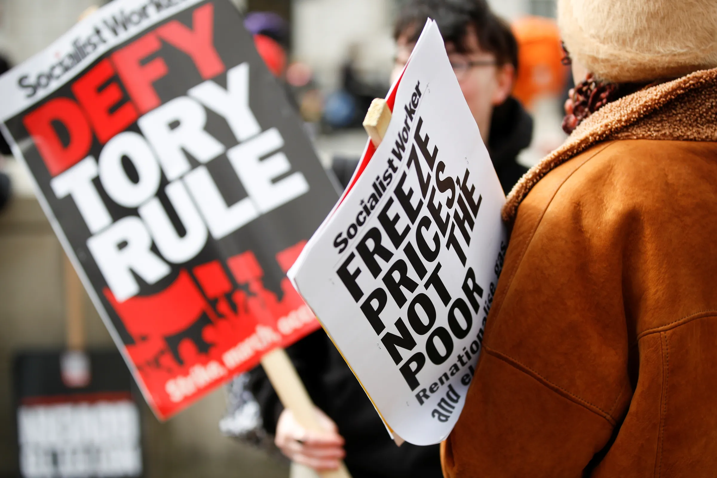 People protest about the rising cost of living during a demonstration outside Downing Street in London, Britain, April 2, 2022