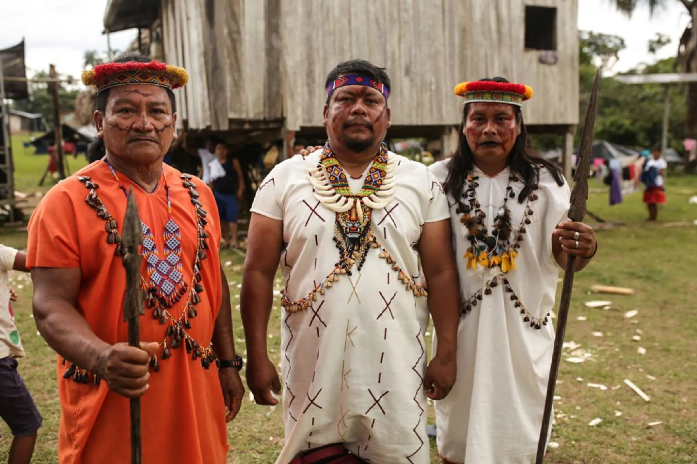 Siekopai leader Justino Piaguaje [middle] stands alongside two community members in their ancestral homeland on the Ecuador-Peru border, Pëkëya.