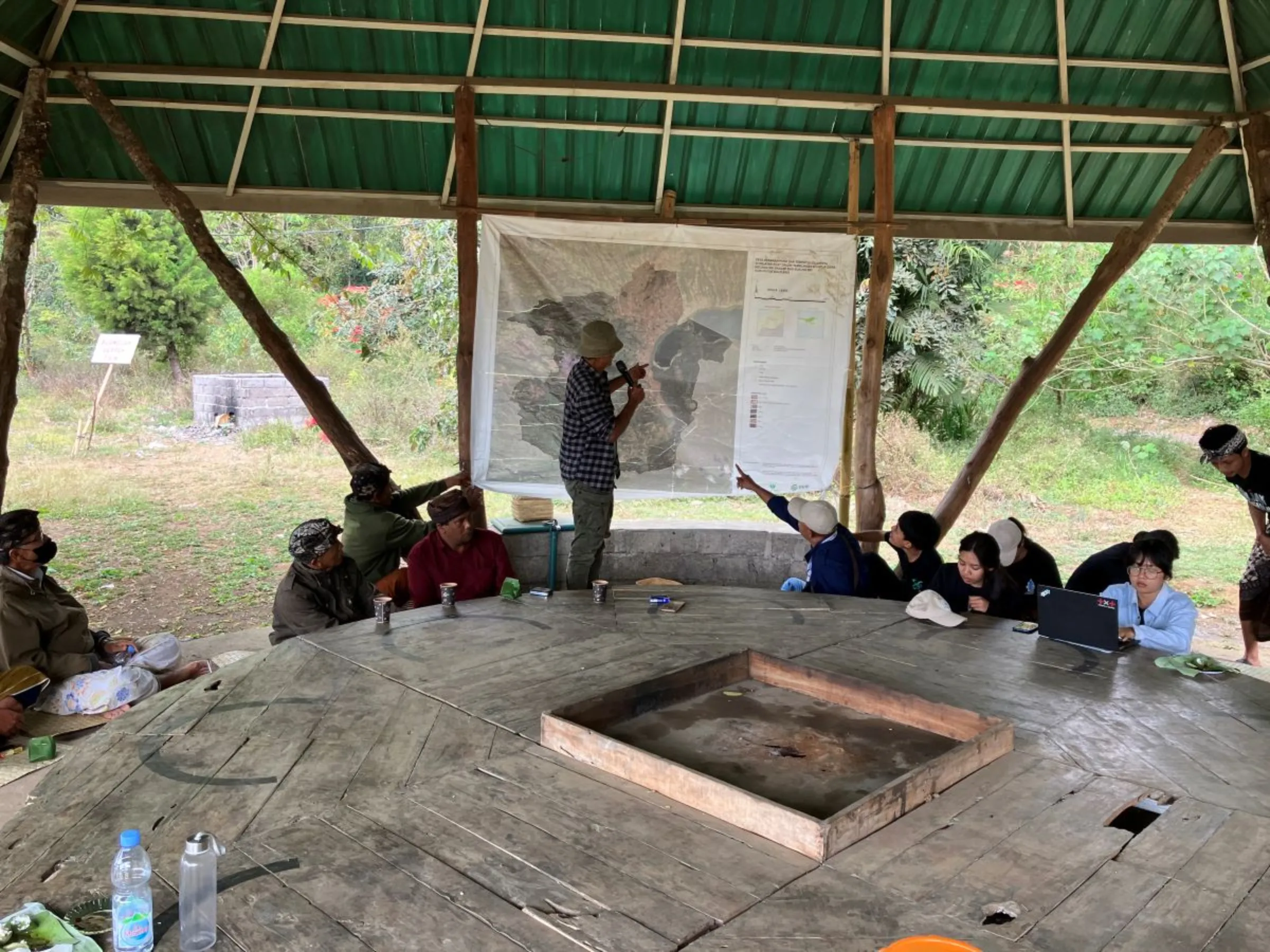 Village leaders from the Adat Dalem Tamblingan Indigenous community talk about their efforts to map their ancient lands in northern Bali, Indonesia on Sept 19, 2023. Thomson Reuters Foundation/Michael Taylor