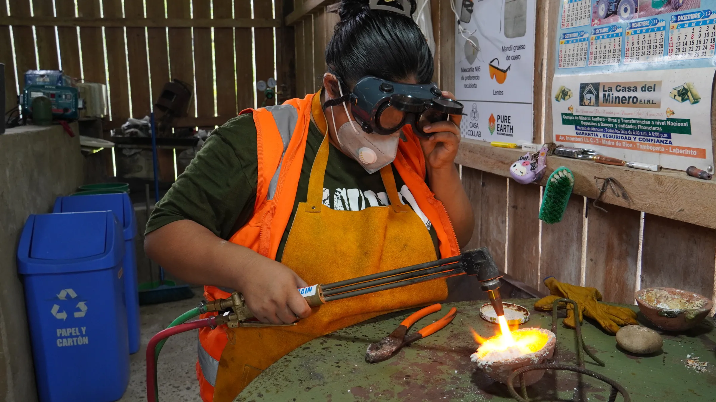Isabel Chua, 25, smelts gold separated using a shaking table, in Laberinto, Madre de Dios, Peru. Thomson Reuters Foundation/Dan Collyns