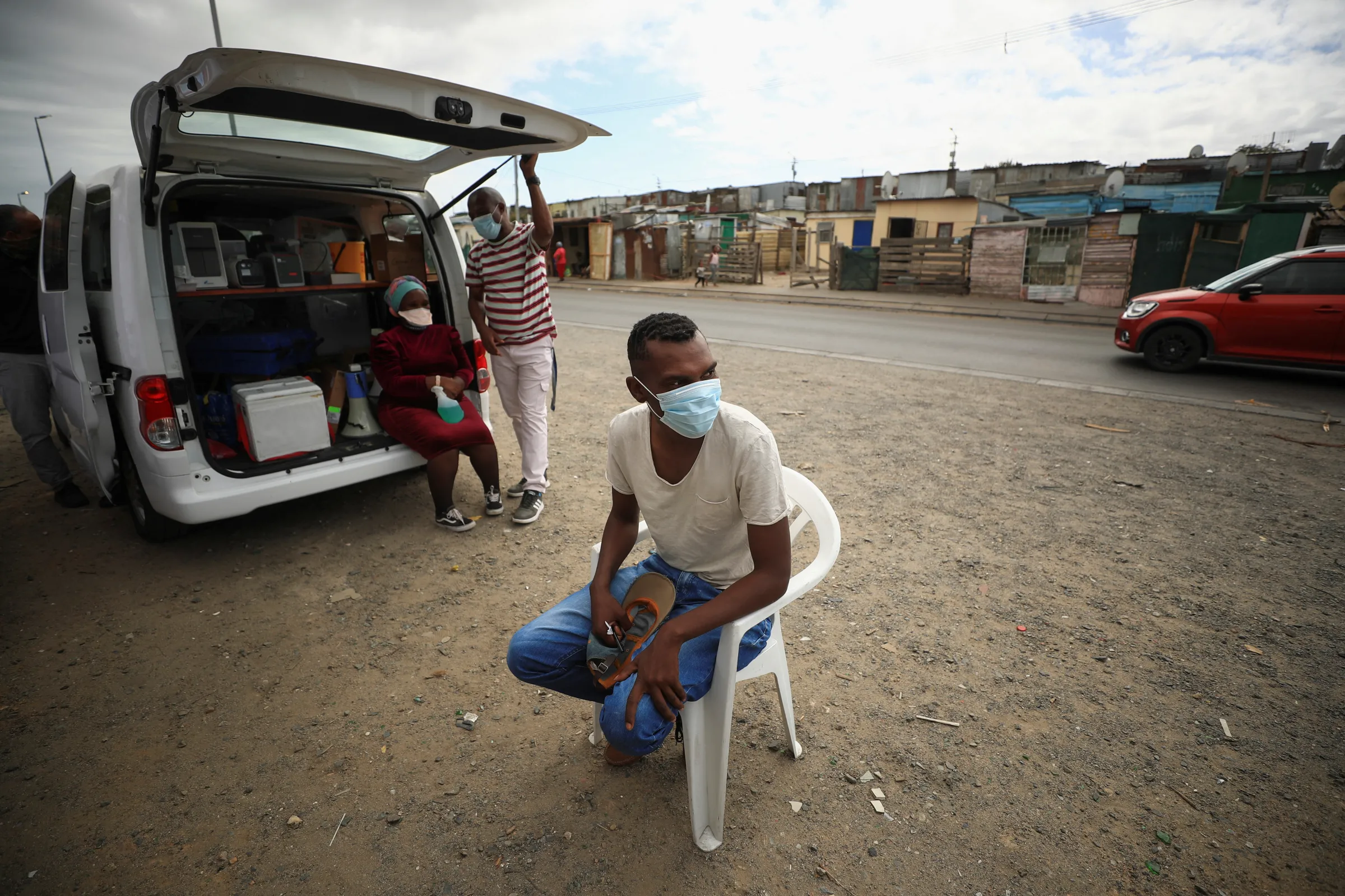 A man waits to be tested for tuberculosis at a mobile clinic in Gugulethu township near Cape Town, South Africa, March 26, 2021. REUTERS/Mike Hutchings