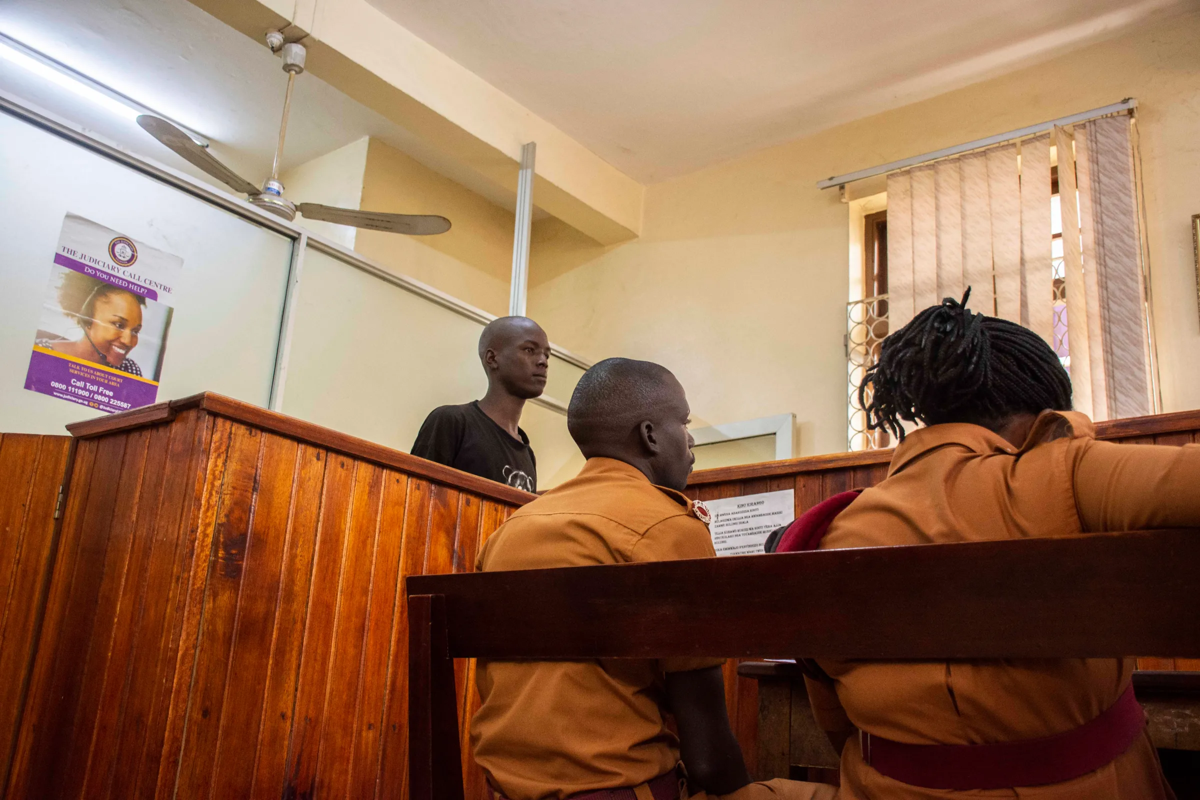 A street vendor stands in the City Hall court after he was arrested for selling merchandise