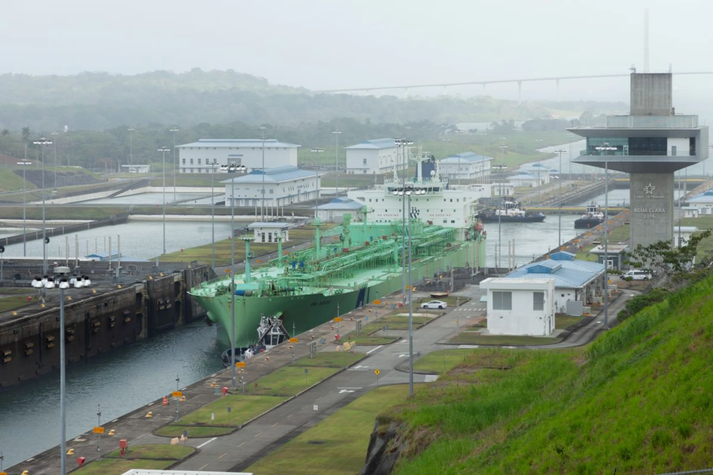A liquefied natural gas tanker at the Agua Clara locks on the Panama Canal, February 16, 2024. Each vessel passing through the 50-mile (80-km) trans-oceanic waterway uses some 51 million gallons (193 million litres) of water from Gatún Lake. Thomson Reuters Foundation/Enea Lebrun.