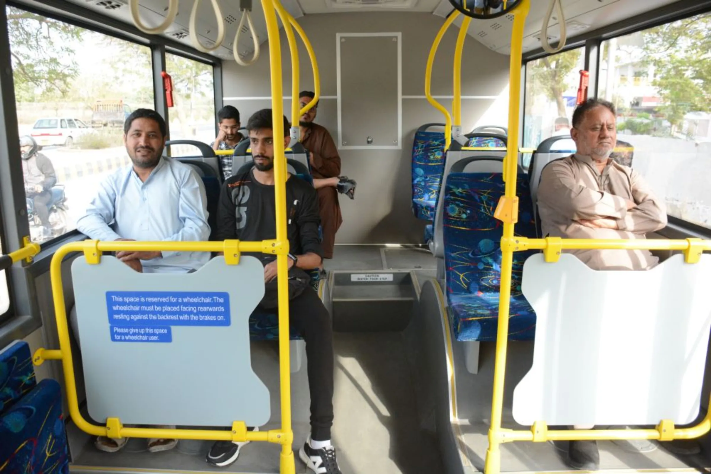 Citizens travel in the newly launched electric bus near airport area, Karachi, Pakistan, March 2, 2023