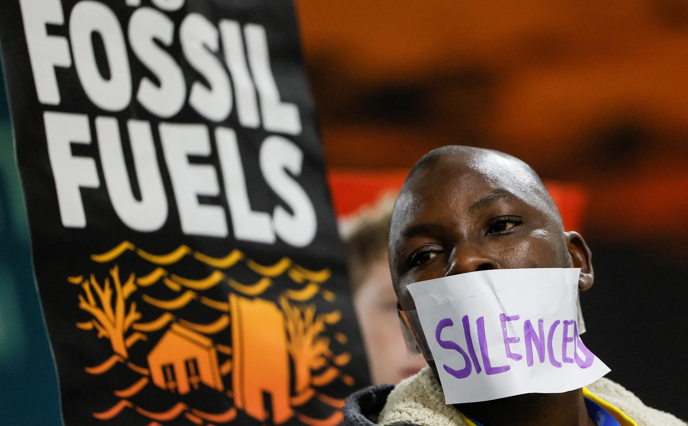 An environmental activist takes part in a protest to urge world leaders to commit to a strong climate finance deal during the United Nations Climate Change Conference (COP29), in Baku, Azerbaijan November 16, 2024. REUTERS/Maxim Shemetov