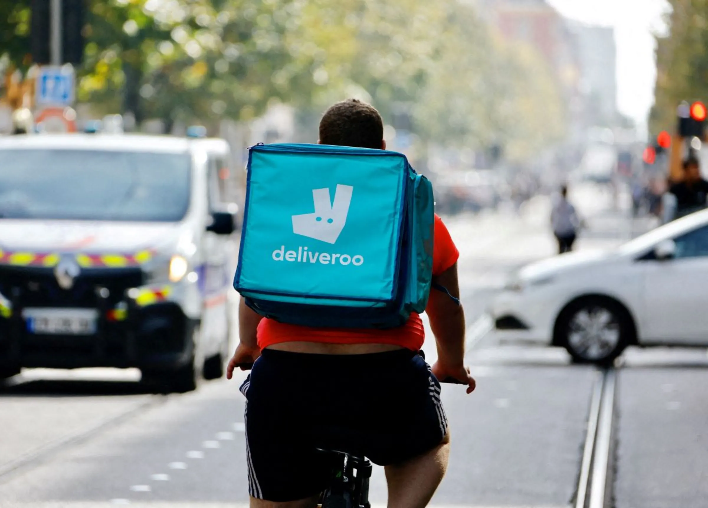 A delivery worker with a backpack of Deliveroo rides a bike in Nice, France, October 25, 2022. REUTERS/Eric Gaillard