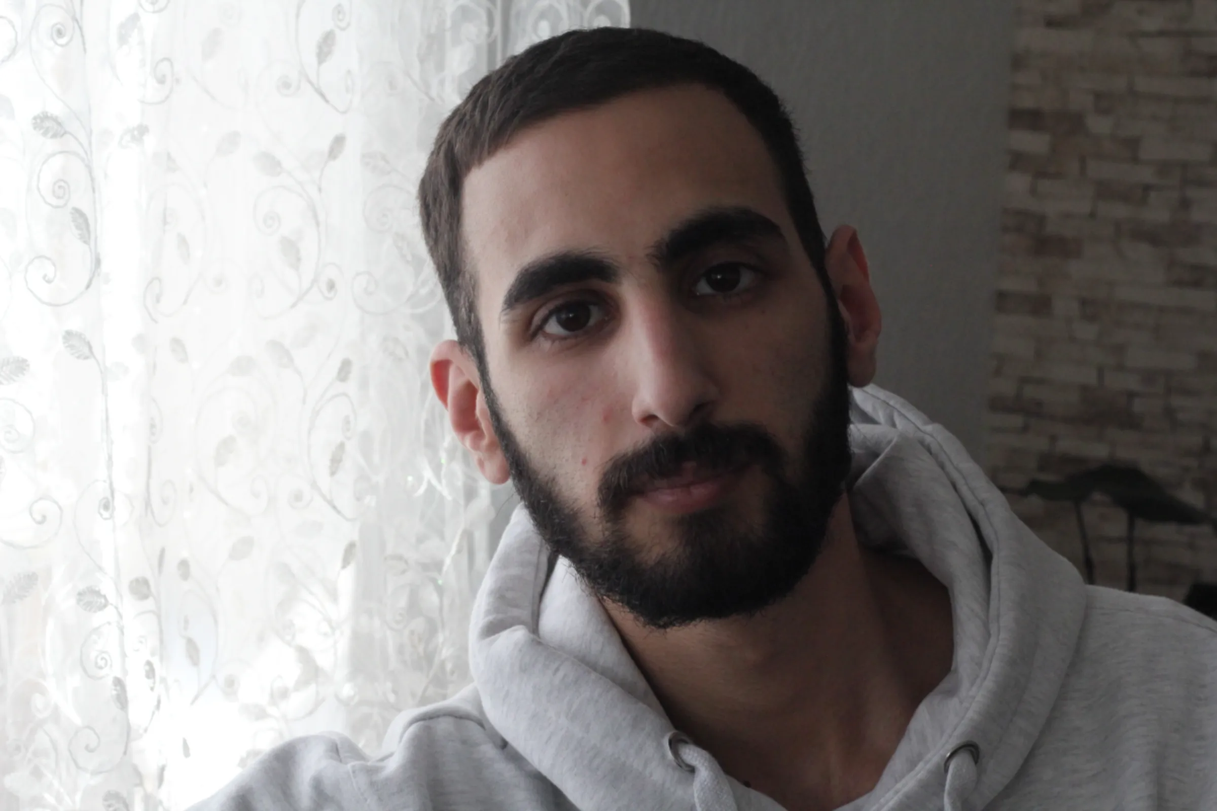 Mahmoud Almohamad, a Syrian refugee and medical student at Aalborg University, at his parents' home in Brønderslev, Denmark. March 2023