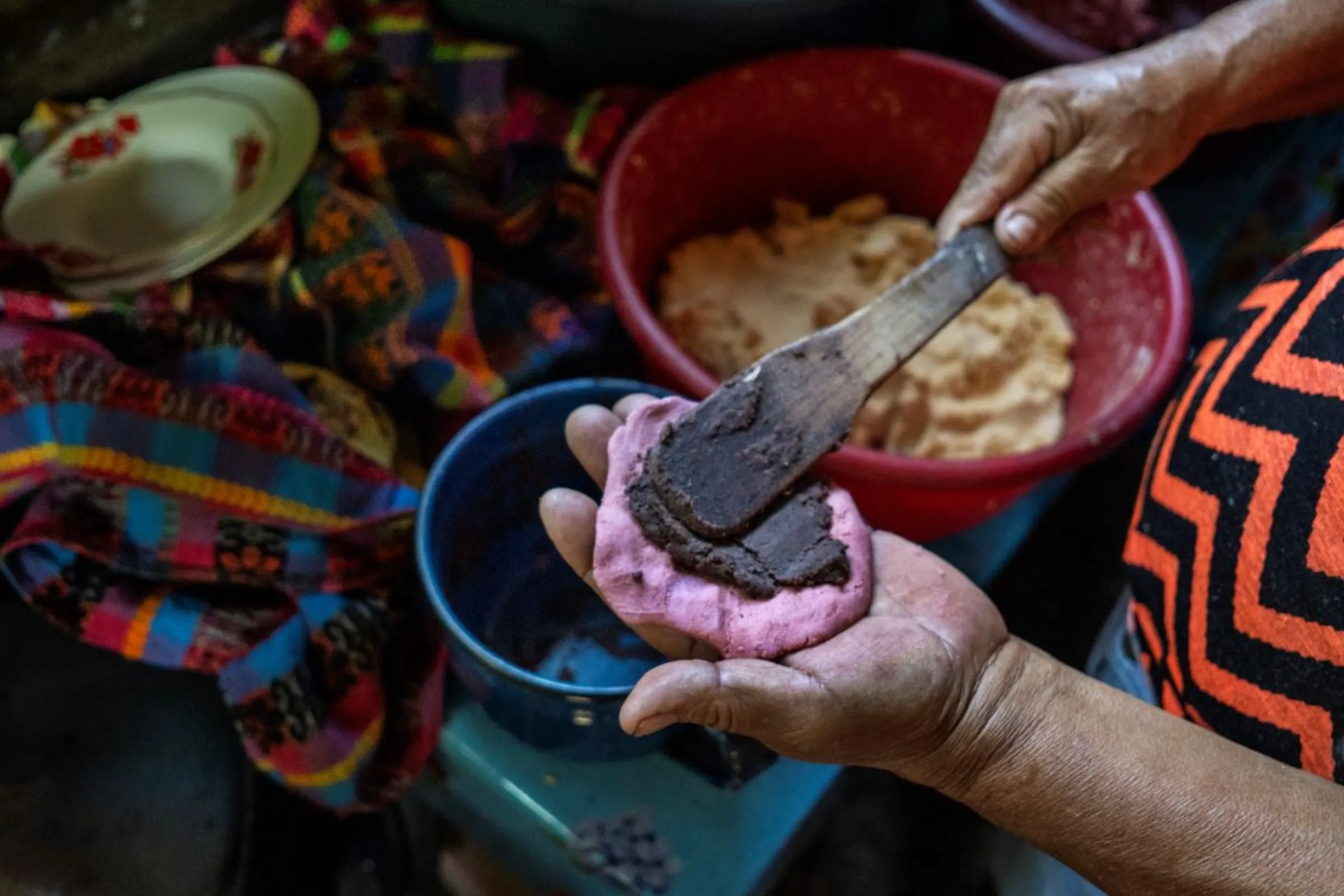 A bean farmer prepares tortilla stuffed with Chorti beans, a staple crop in Guatemala in a kitchen in the province of Chiquimula, Guatemala, September 6, 2023. Thomson Reuters Foundation/Fabio Cuttica