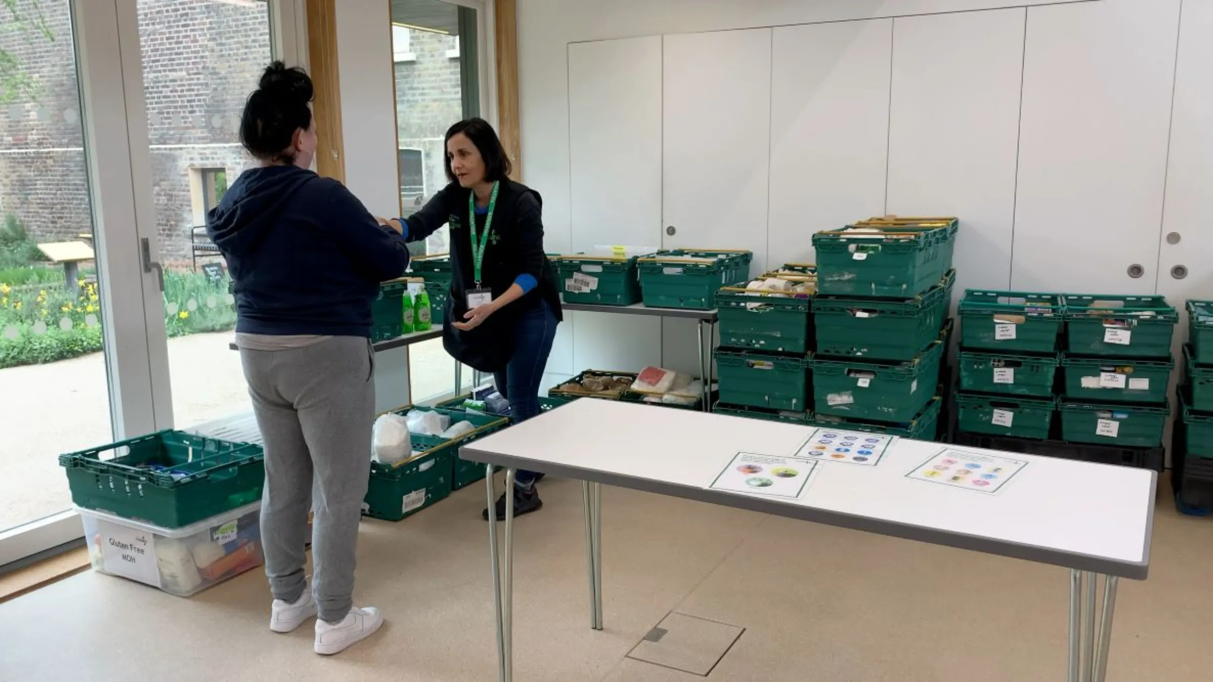 Foodbank recipients at a Hackney Foodbank hub collect donated food and essential items in east London, Britain on April 24, 2023