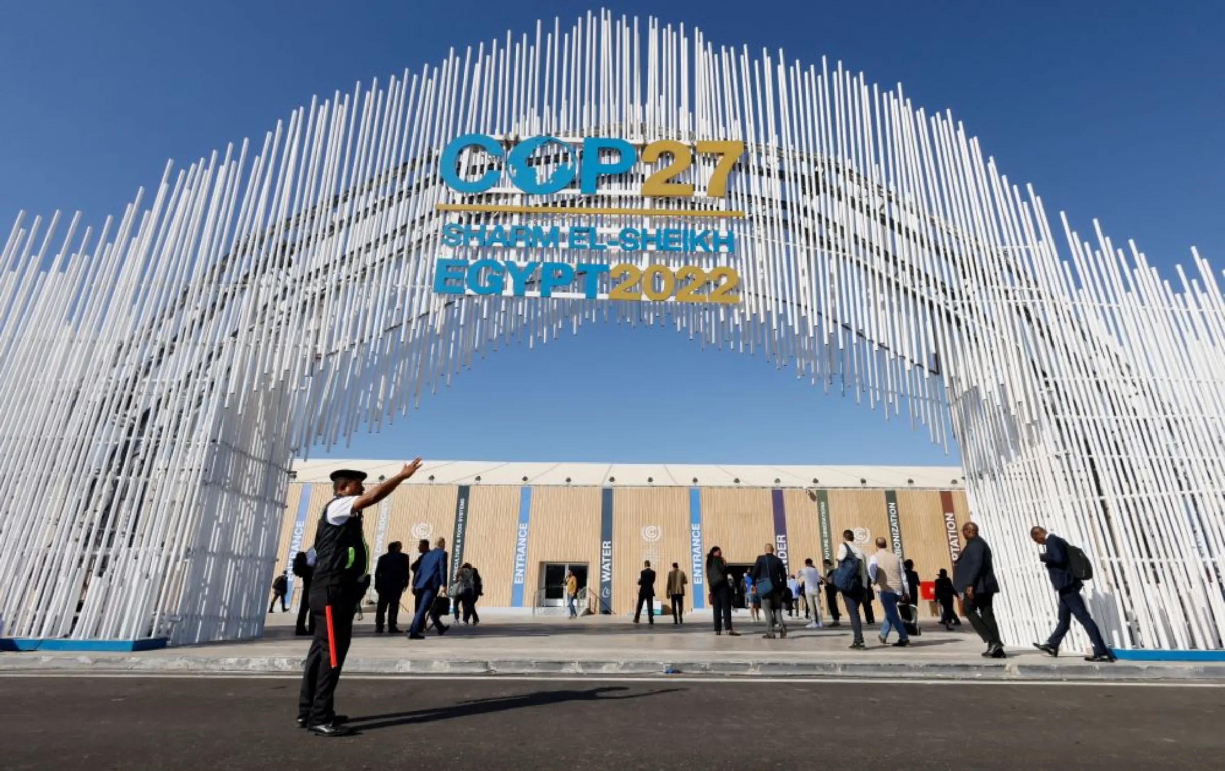 A police officer stands in front of the entrance of the Sharm El Sheikh International Convention Centre during the COP27 climate summit in Egypt's Red Sea resort of Sharm el-Sheikh, Egypt November 9, 2022