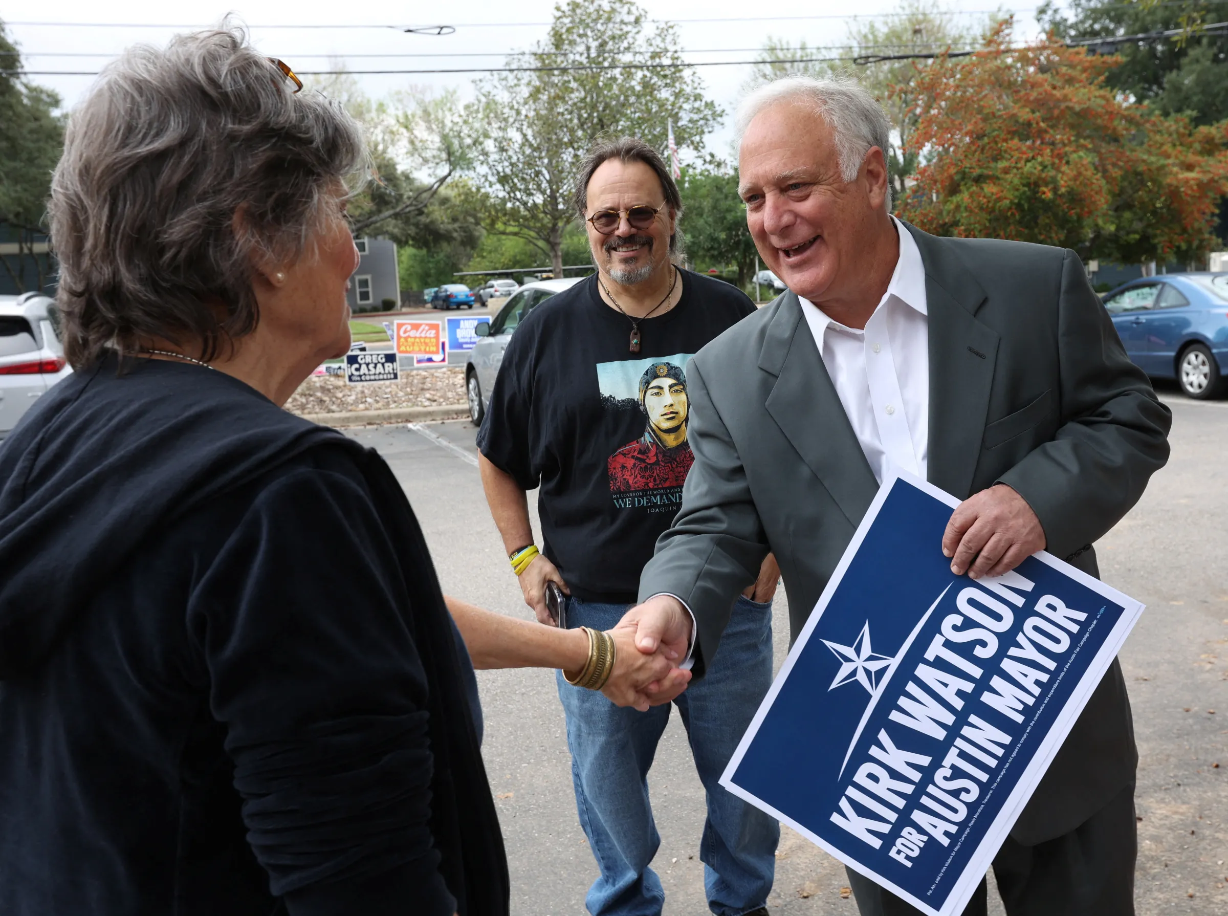 Mayoral candidate Kirk Watson, greets a poll watcher at the Ben Hur Shrine Temple precinct during the U.S. midterm elections in Austin, Texas, U.S., November 8, 2022. REUTERS/Nuri Vallbona