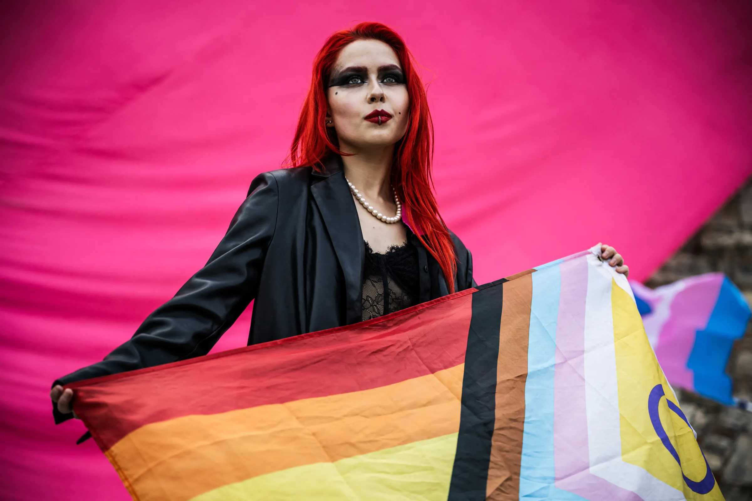 A woman holds a flag during a march in Budapest, Hungary, March 30, 2025. REUTERS/Marton Monus