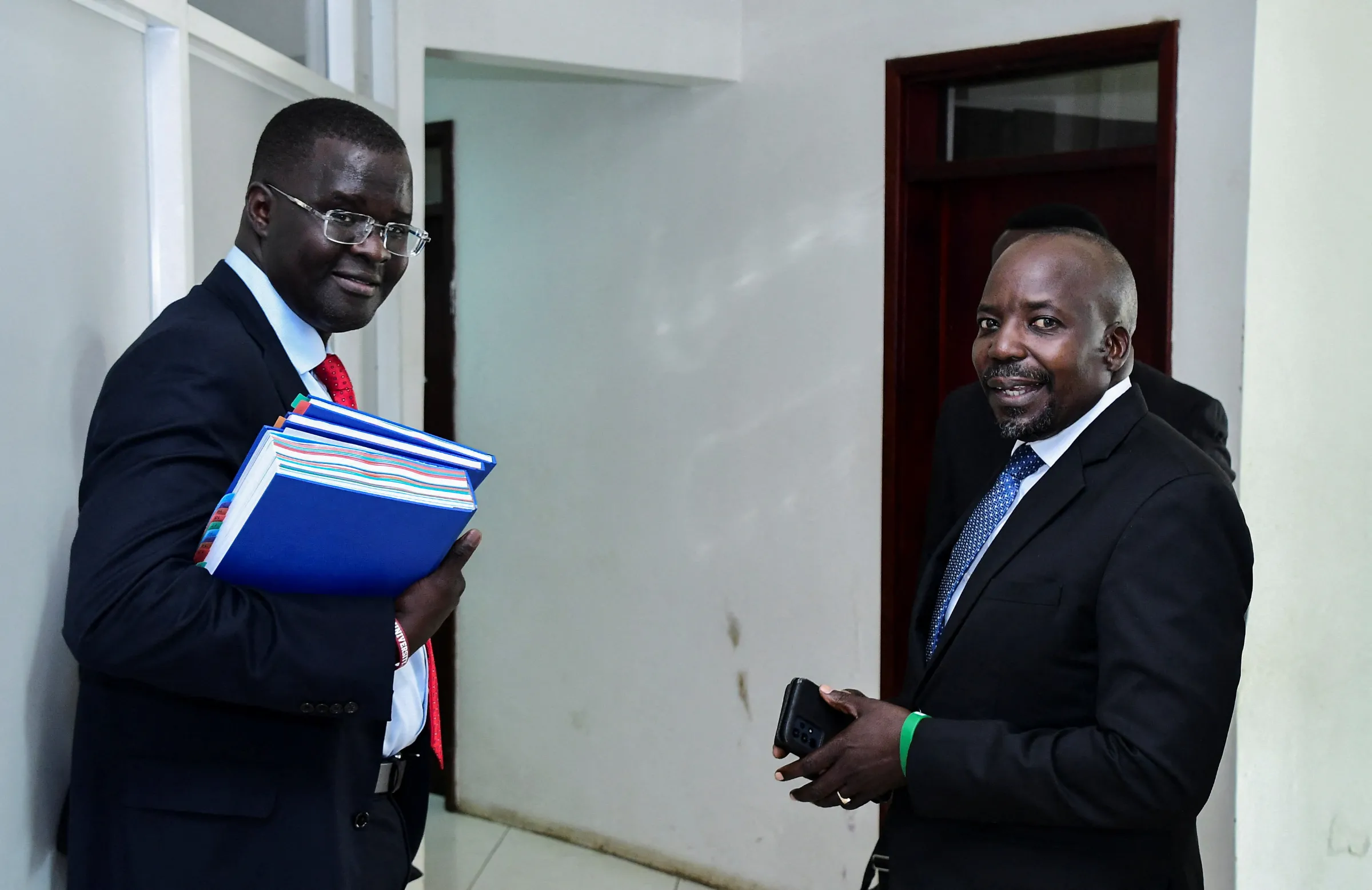 Human Rights lawyer Nicholas Opiyo and West Budama North East Constituency Member of Parliament Fox Odoi-Oywelowo arrive to file a petition against the Anti-gay law at the constitutional court in Kampala, Uganda October 2, 2023. REUTERS/Abubaker Lubowa