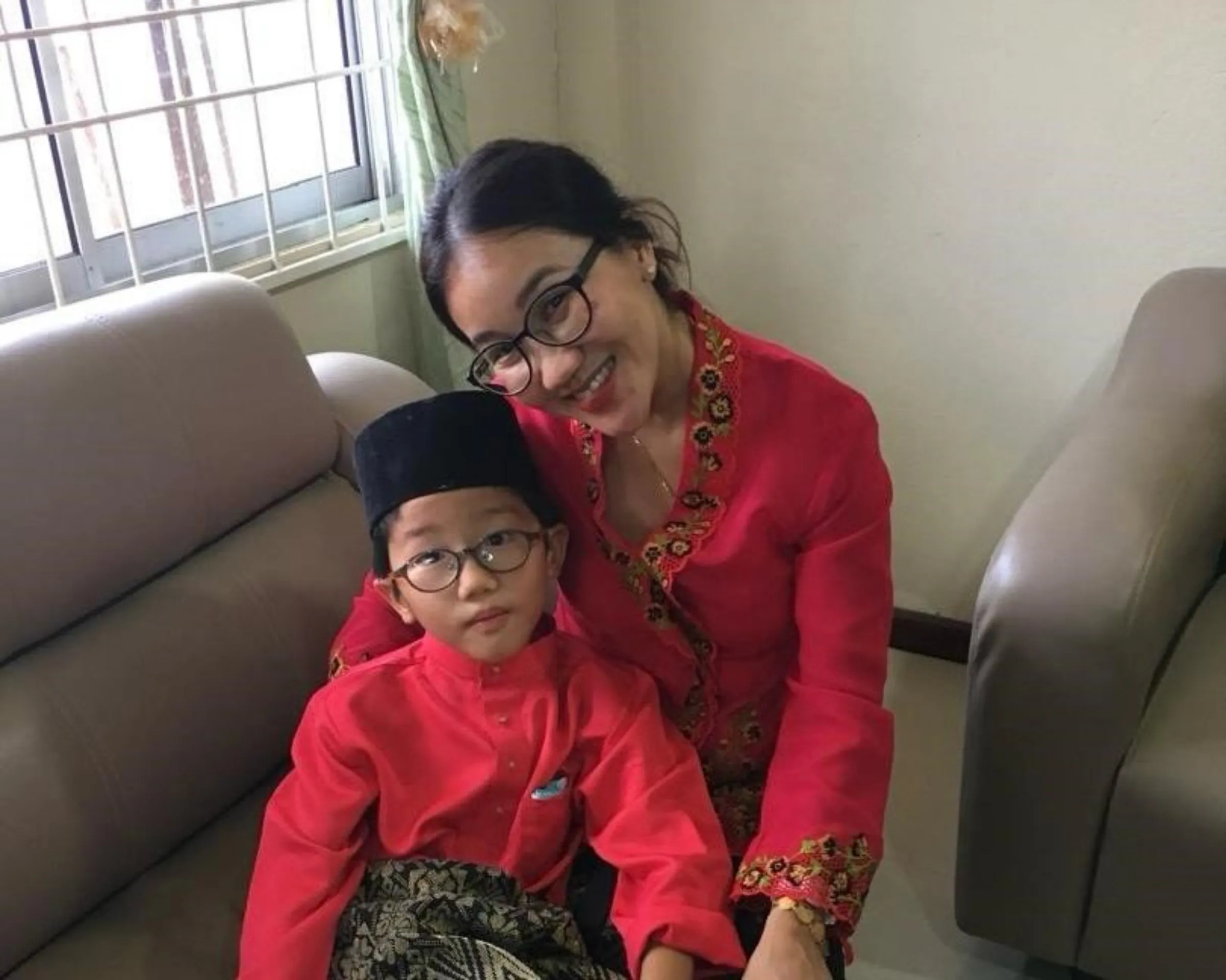 Adlyn Teoh, president of Family Frontiers, and son Reis are seen in an undated photo taken in Sarawak, Malaysia. Adlyn Teoh/Handout via Thomson Reuters Foundation