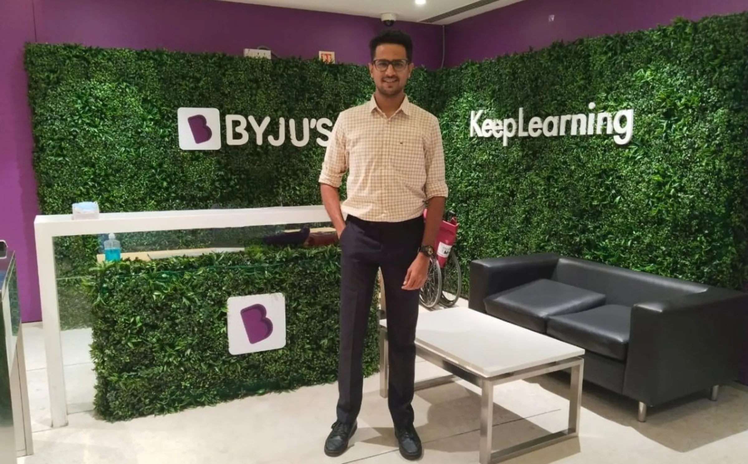 Pratik Makhija, a former employee at Indian edtech giant Byju's, poses for a photo at the office reception in Bengaluru, India, October 17, 2022