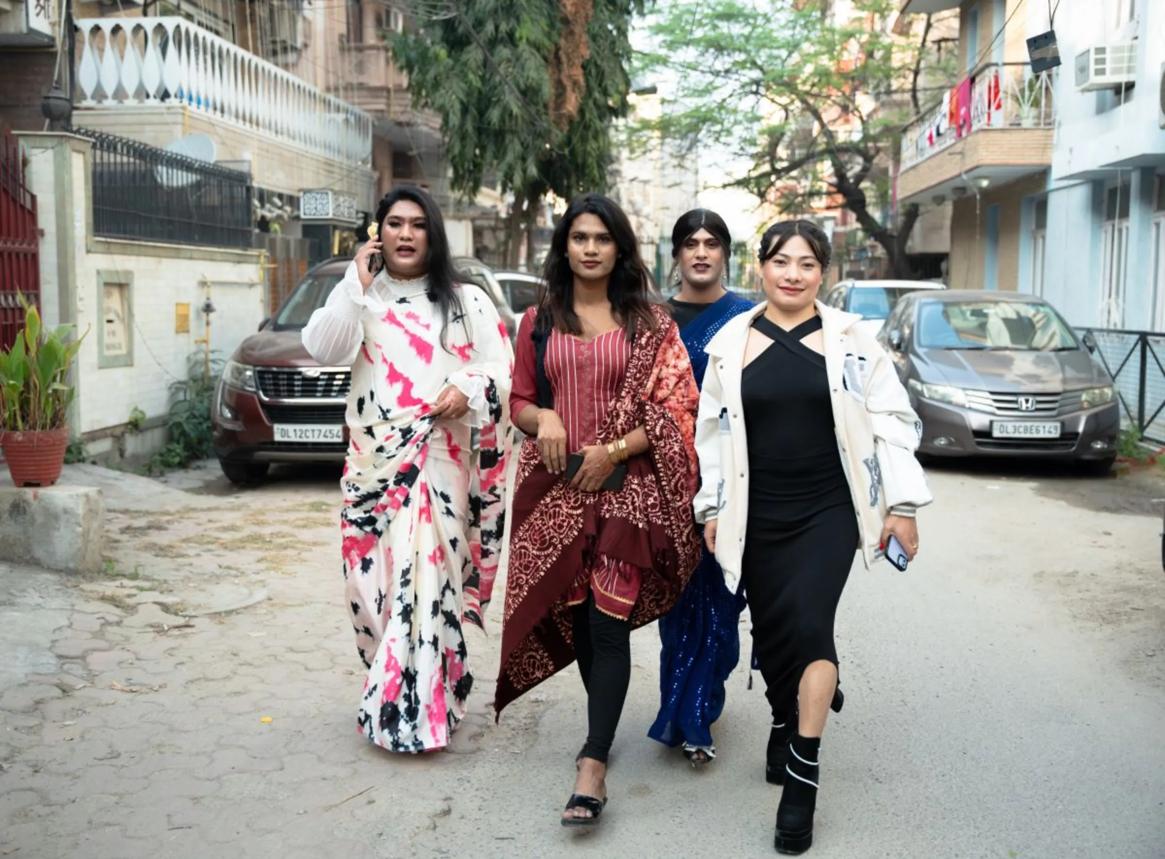 A group of transgender women walks in a neighbourhood in New Delhi, India, December 18, 2023. Thomson Reuters Foundation/Mehran Firdous