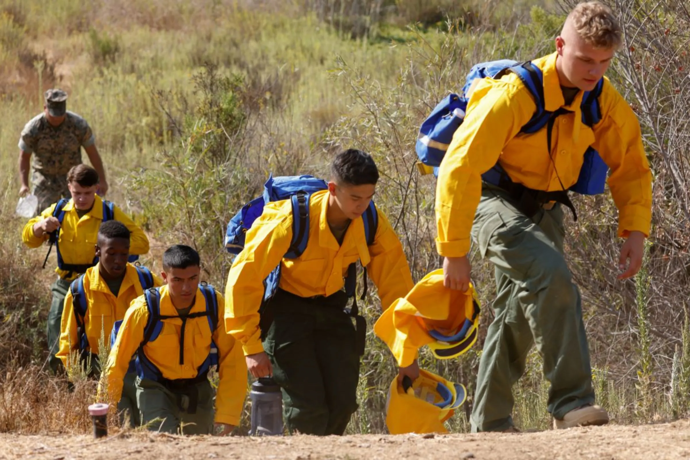 U.S. Marines and Sailors with 7th Engineer Support Battalion wear new fire fighting gear as they train with professional wildland firefighters in preparation  to help fight fires in California from Camp Pendleton, California, U.S., September 18, 2020