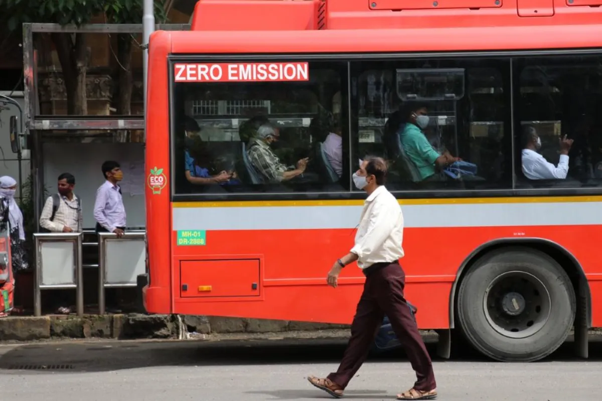 A man walks past an electric bus in Mumbai, India, September 15, 2021