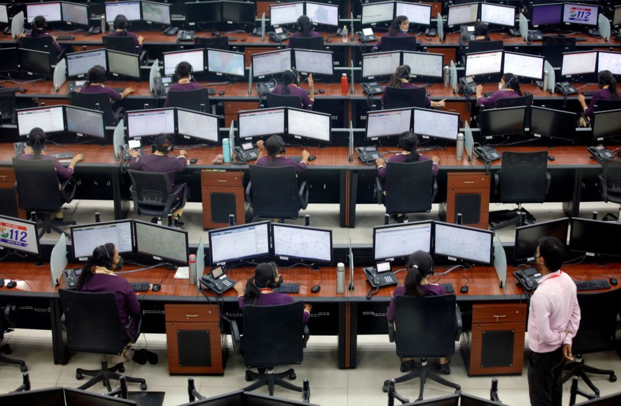 Employees work inside a call centre in Lucknow, India, April 21, 2020. REUTERS/ Pawan Kumar