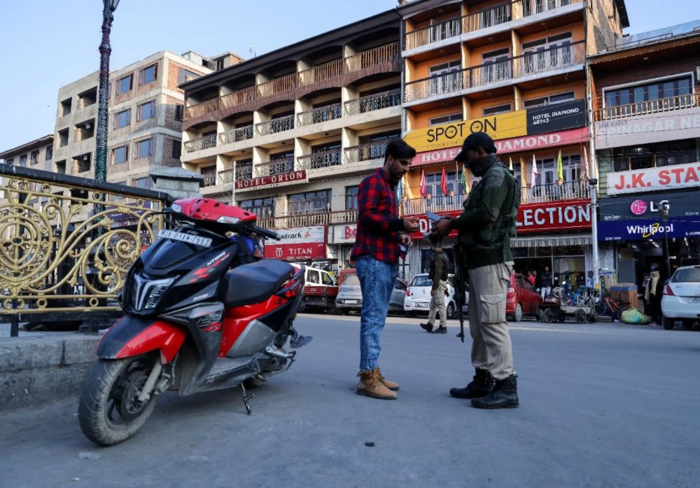 Security forces check the identification documents of a motorist in the Kashmiri city of Srinagar, India. October ‎21, ‎2021