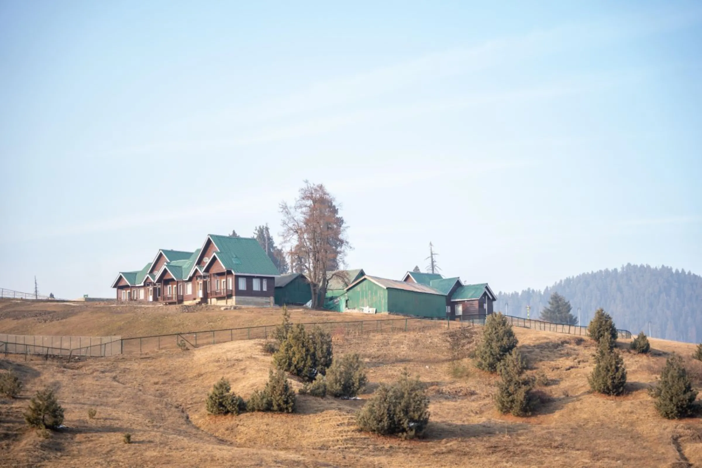 A view of snow-free slopes in Gulmarg, a Kashmiri winter sports town. The northern Indian region has seen little snowfall this year, Jan. 6, 2024. Thomson Reuters Foundation/Mehran Firdous