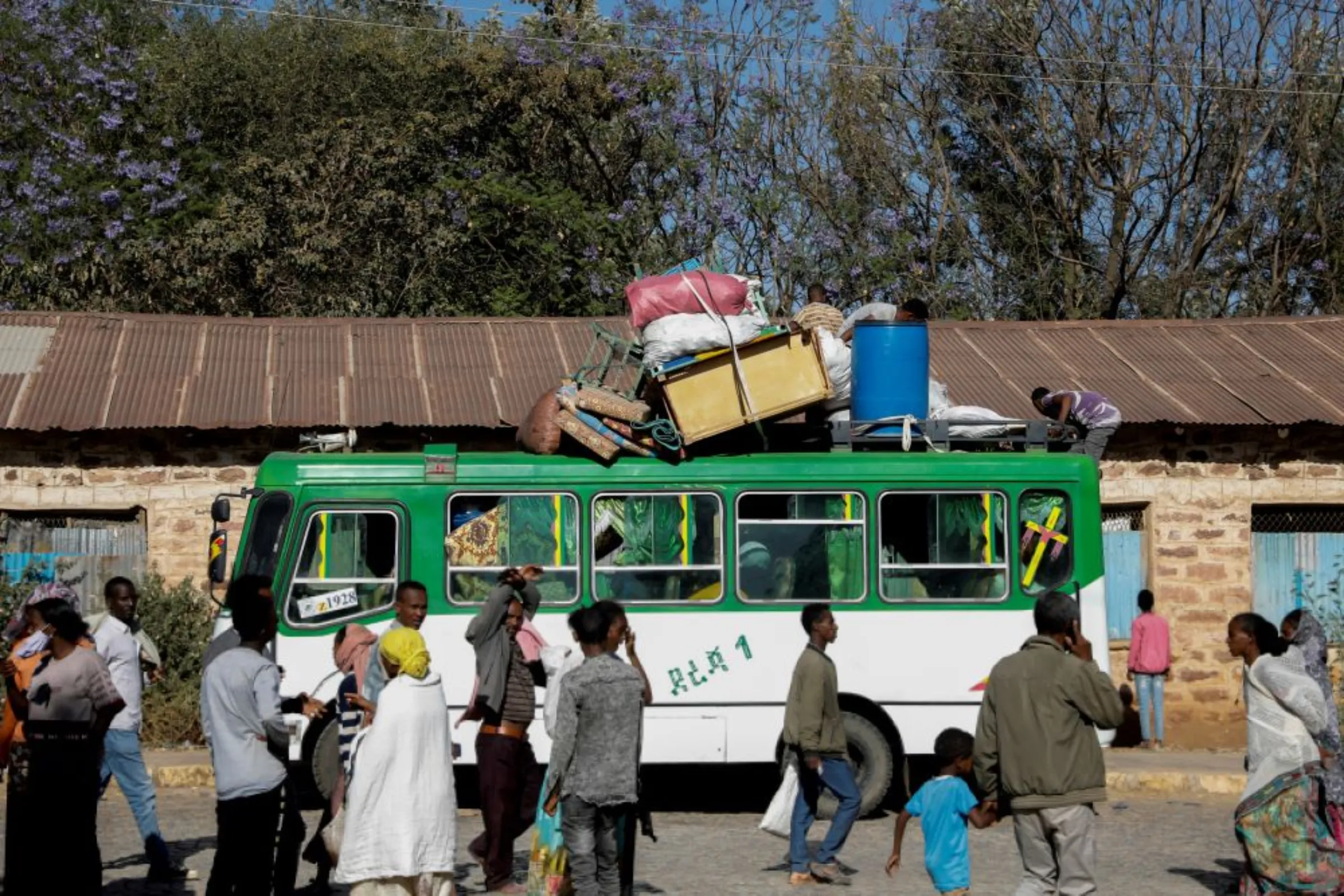 A bus carrying displaced people arrives at the Tsehaye primary school, which was turned into a temporary shelter for people displaced by conflict, in the town of Shire, Tigray region, Ethiopia, March 14, 2021
