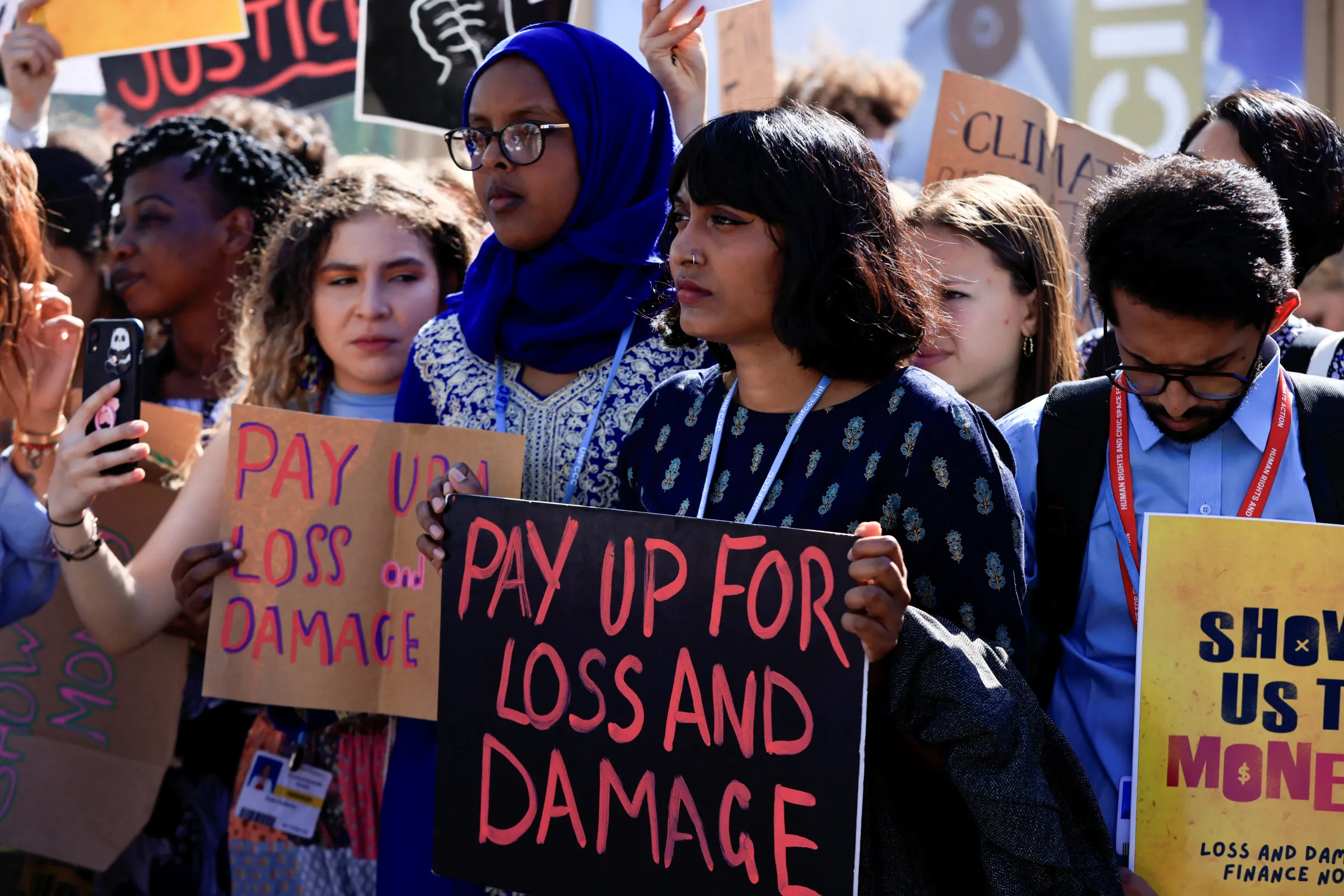 Indian climate activist Disha Ravi holds a placard as she takes part in the Fridays for Future strike during the COP27 climate summit, in Sharm el-Sheikh, Egypt, November 11, 2022