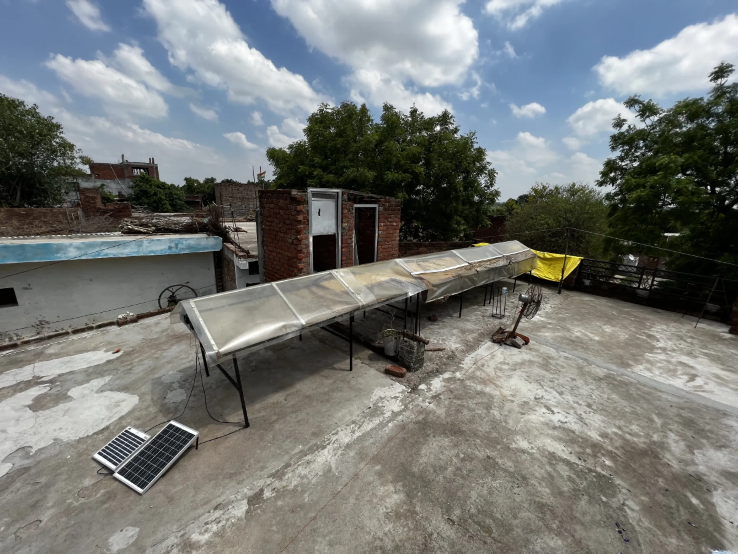 Shivraj Nishad has installed his solar dryer on the roof of his house in the village. Compared to open air drying the solar-powered appliance has halved drying time for flowers. Kanpur, India, June 27, 2023.Thomson Reuters Foundation/Bhasker Tripathi