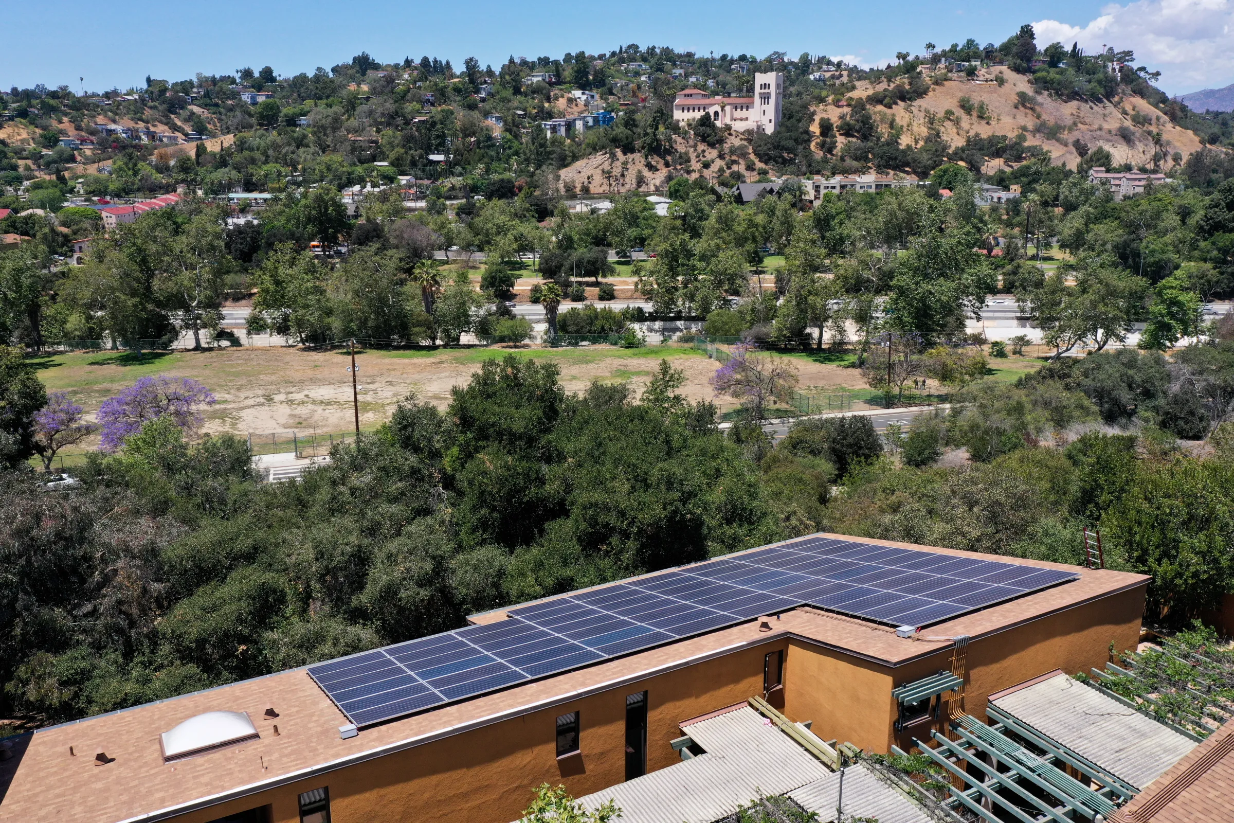 Solar panels cover the rooftop of the Convention Center in downtown Los Angeles, California, May 28, 2021. Thomson Reuters Foundation/Aude Guerrucci