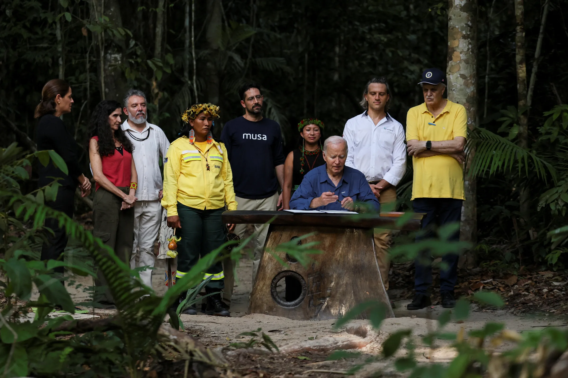 Carlos Nobre poses alongside climate leaders as U.S. President Joe Biden signs a proclamation designating November 17 as 'International Conservation Day', in Manaus, Brazil, November 17, 2024. REUTERS/Leah Millis