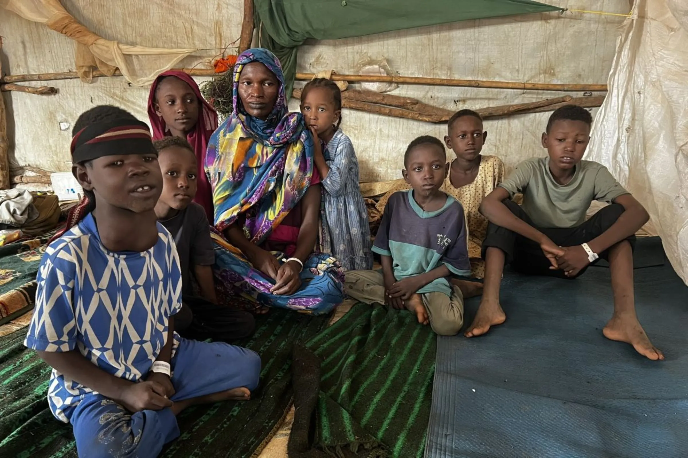 Halima, 33, poses for a picture with her children at Doro Reception Centre for refugees in Maban county, South Sudan, on August 1, 2024. Sudan's war has created the world's largest child displacement crisis, with nearly 5 million children forced from their homes since the fighting began. Thomson Reuters Foundation/Nita Bhalla